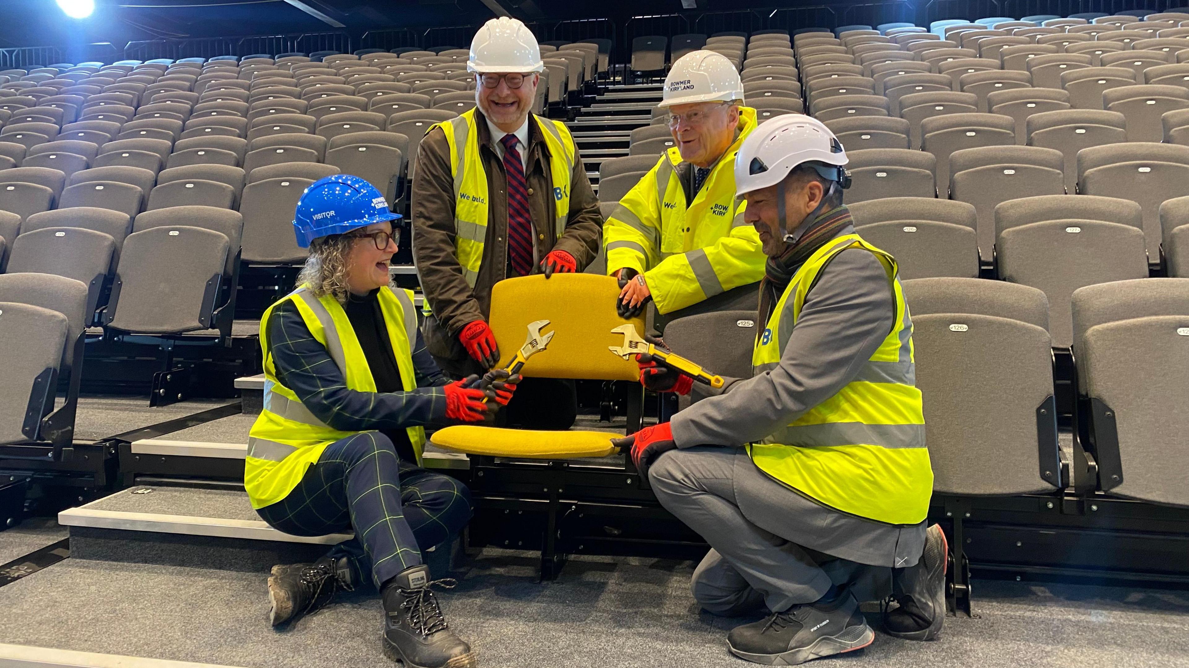 Councillor Nadine Peatfield, Paul Morris, Robert Kirkland and Marcus Sheehan placing the final seat at Becketwell Arena in Derby