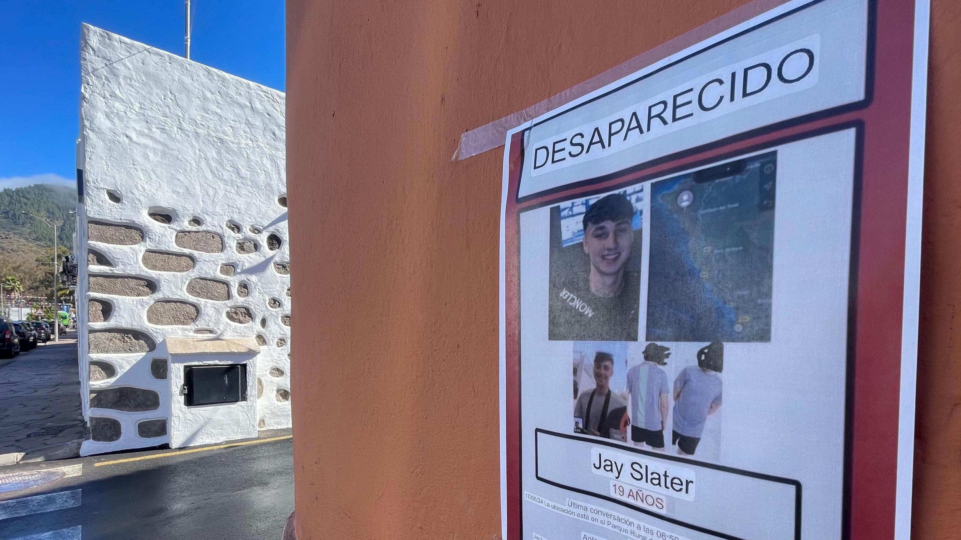 A missing poster with a photograph of Jay Slater stuck to the wall of a building in Spain