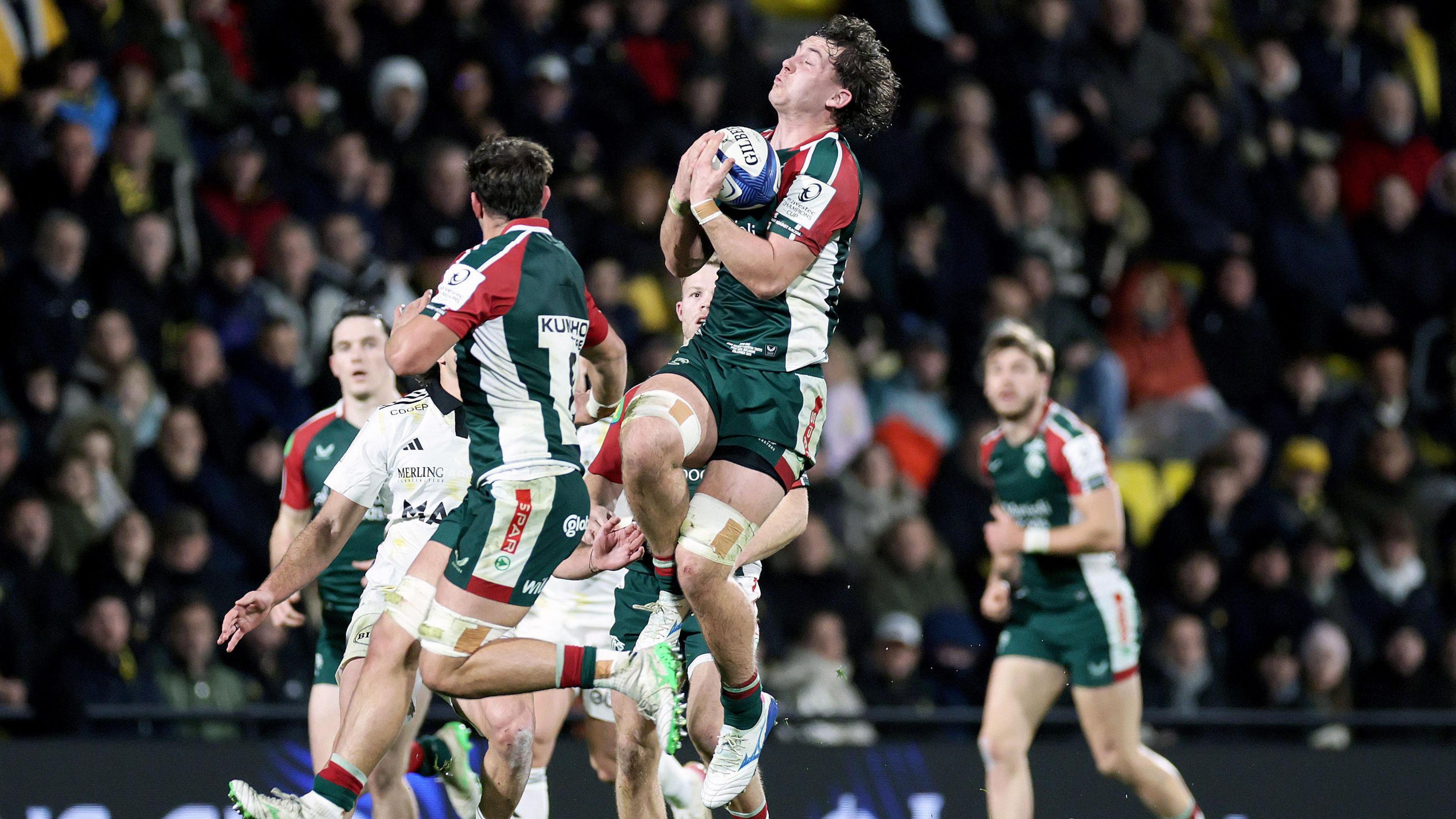 A Leicester Tigers player takes a catch against La Rochelle