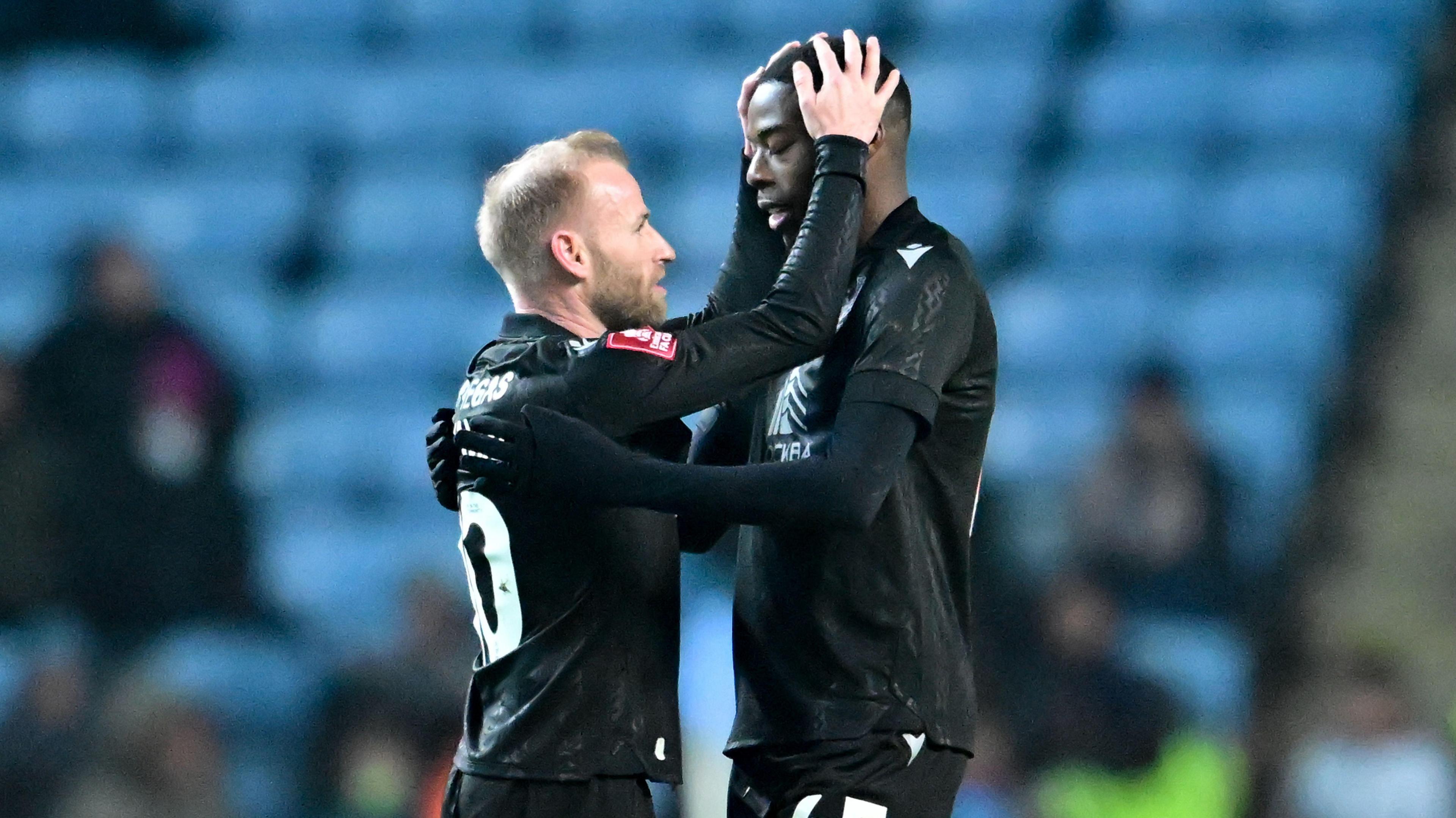 Sheffield Wednesday skipper Barry Bannan helps to celebrate Anthony Musaba's injury-time equaliser