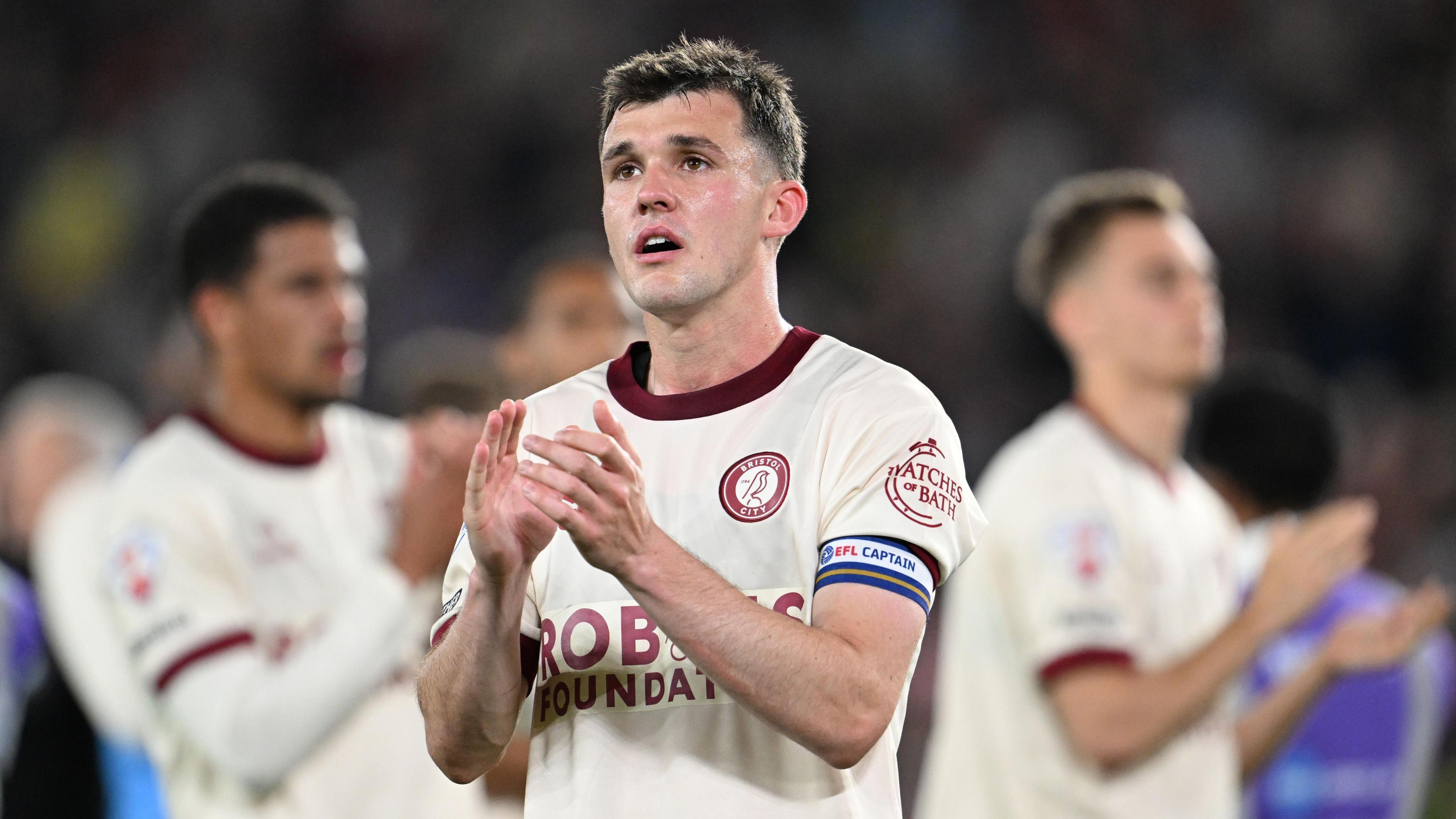 Jason Knight applauds fans at the full-time whistle at Bramall Lane