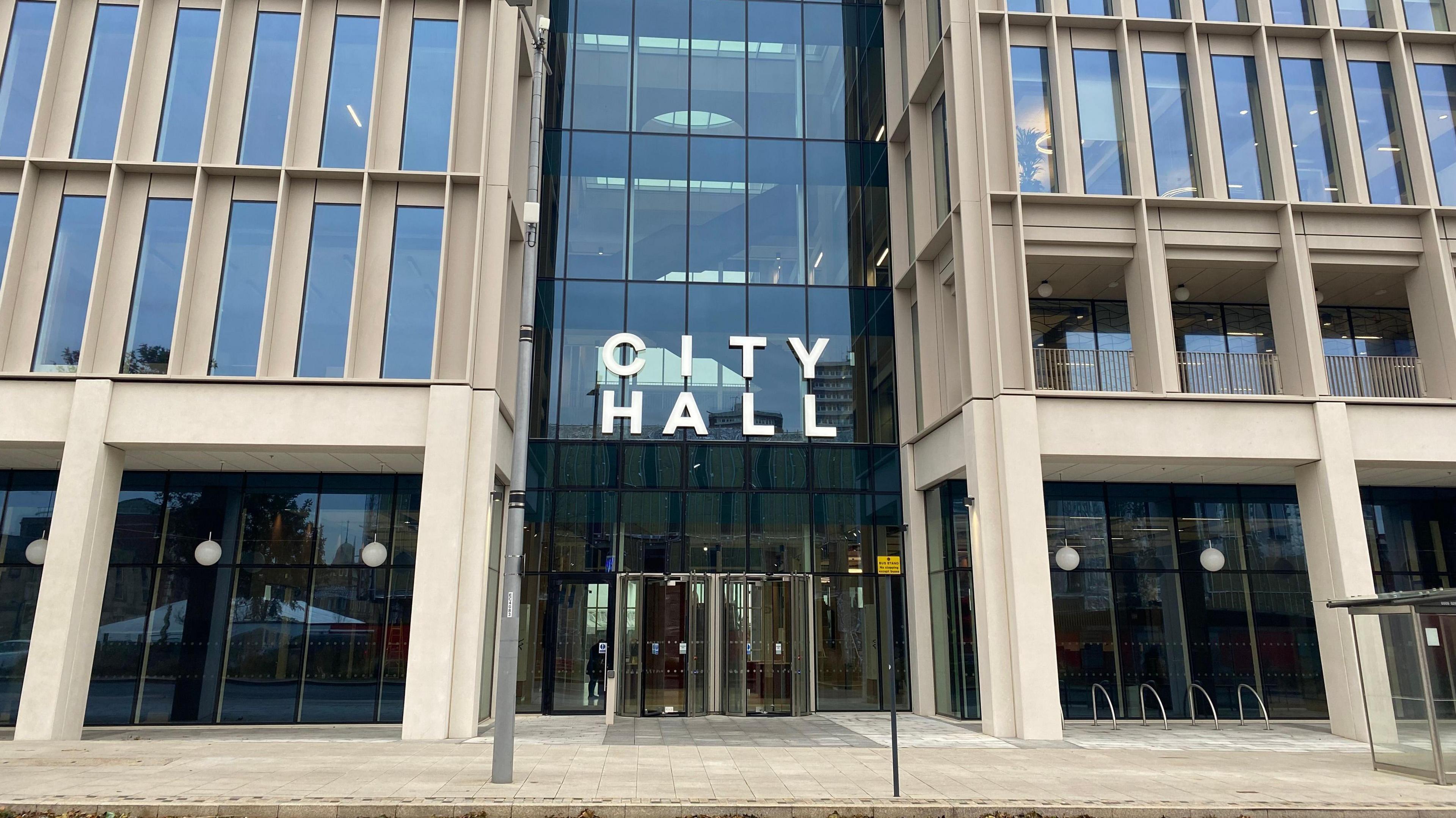 Sunderland City Hall. It is a tall glass building with revolving doors at the entrance. 