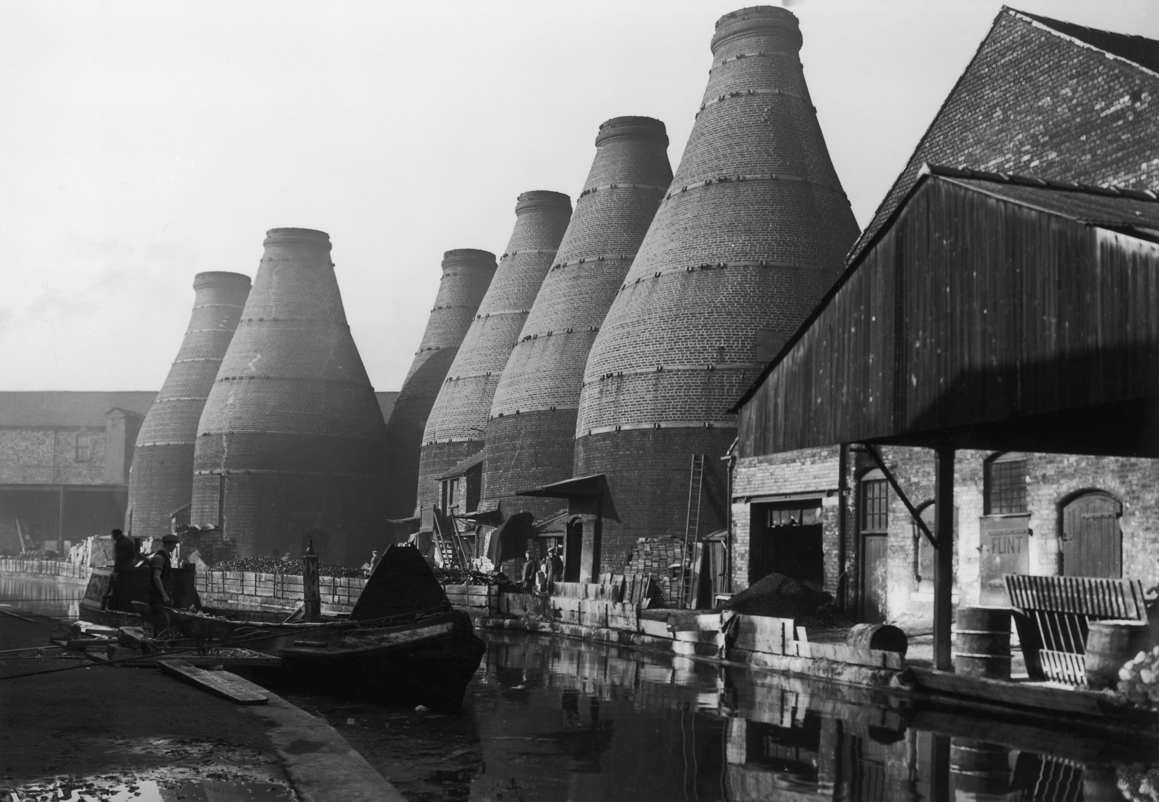 Firing kilns alongside the canal at Stoke-on-Trent, November 1948. It has been the capital of the Potteries since 1910 when the towns of Stoke, Hanley, Burslem, Fenton, Tunstall and Longton were amlgamated.