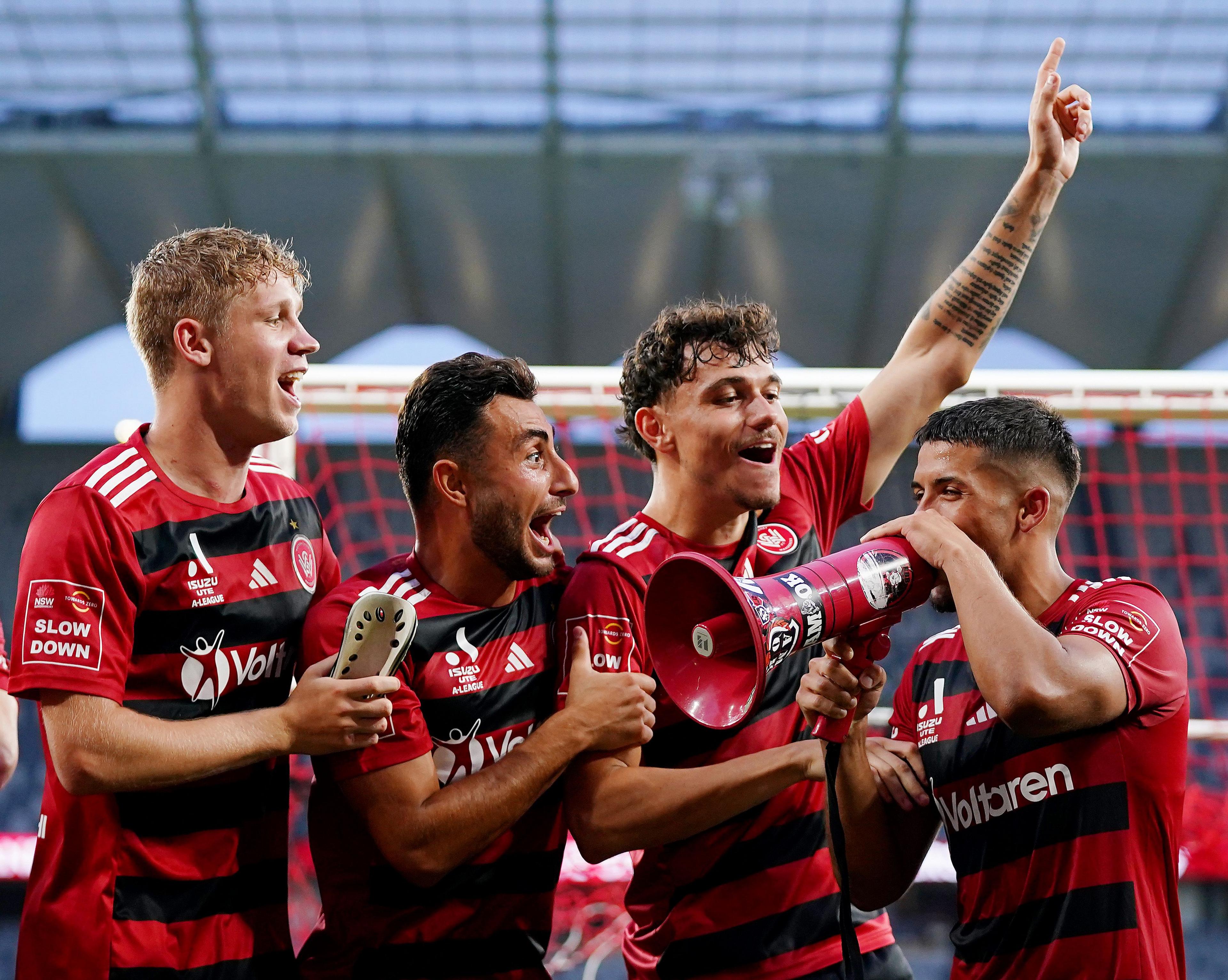 Western Sydney Wanderers' Zachary Sapsford, Jarrod Carluccio, Dean Pelekanos and Aydan Hammond celebrate victory during the round 21 A-League Men match against Perth Glory at CommBank Stadium in Sydney, Australia