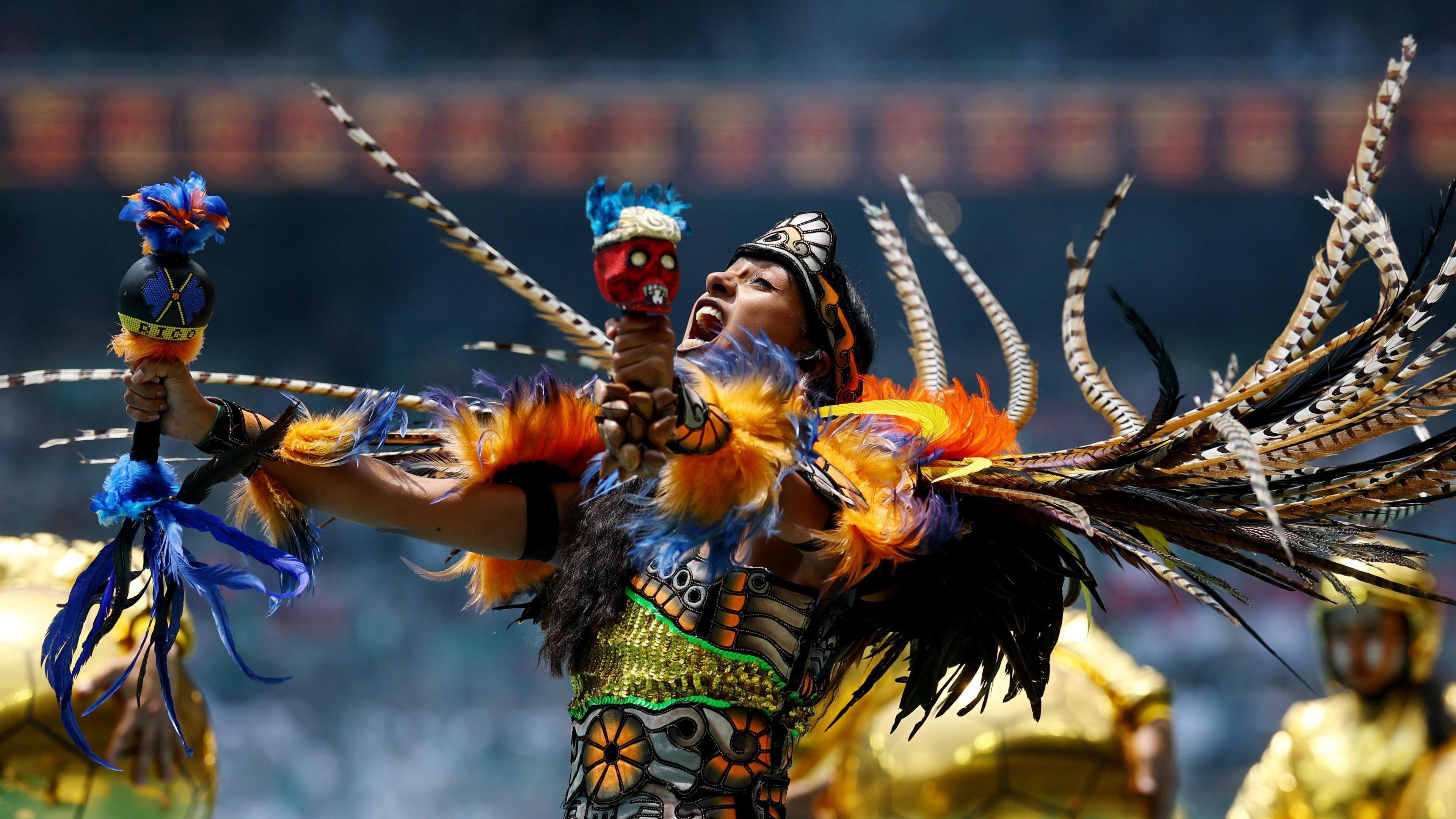 Performers during the opening ceremony before the match