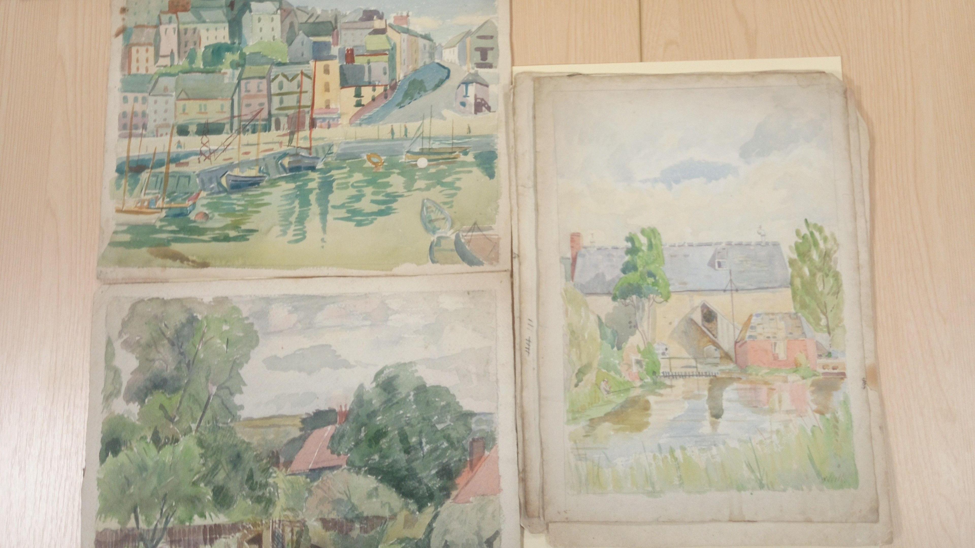 Three watercolour sketches depicting a coastal town, another a water mill and another a building behind some trees.