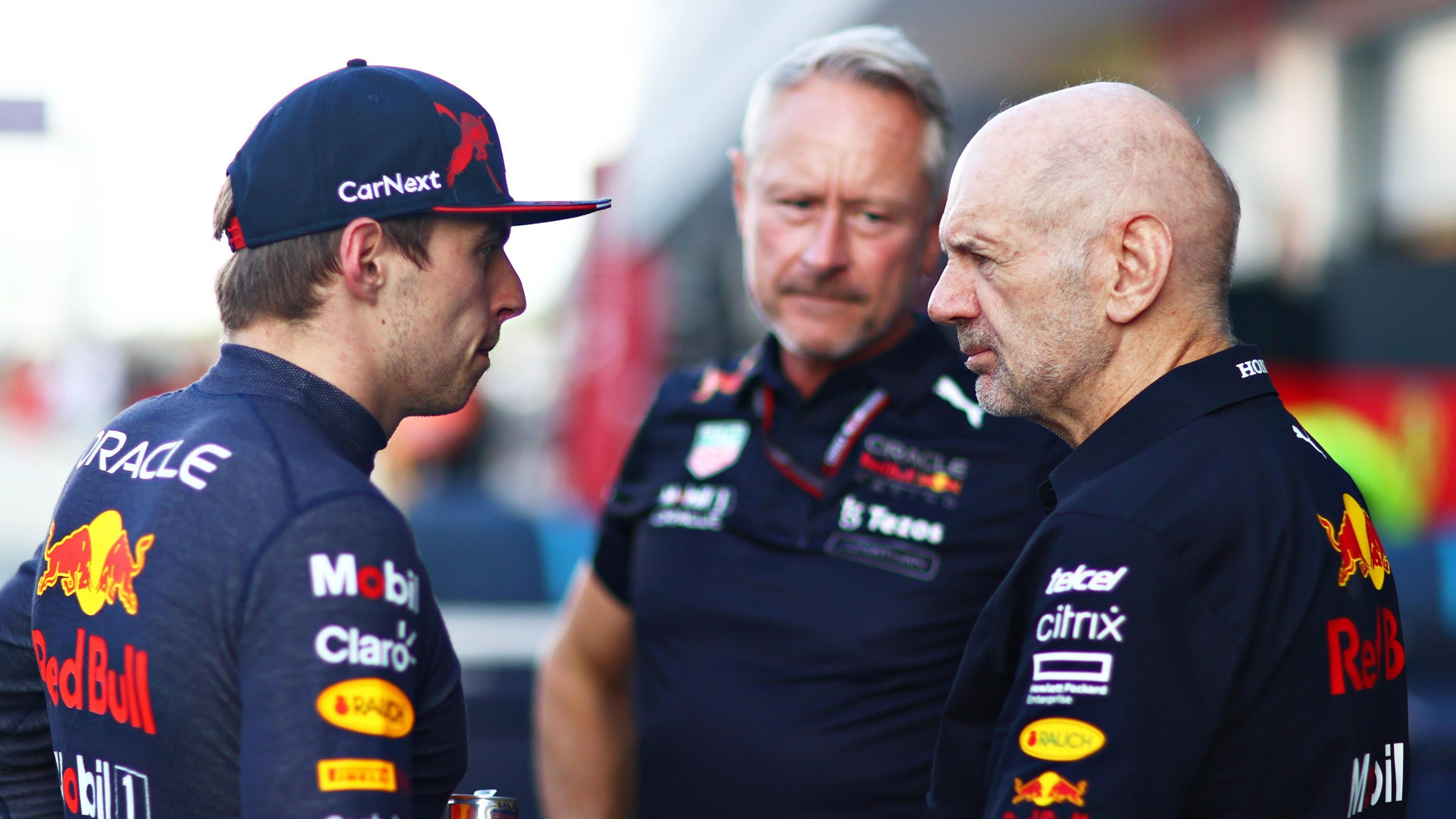 Red Bull driver Max Verstappen (left) speaks to Jonathan Wheatley (centre) and Adrian Newey (right)