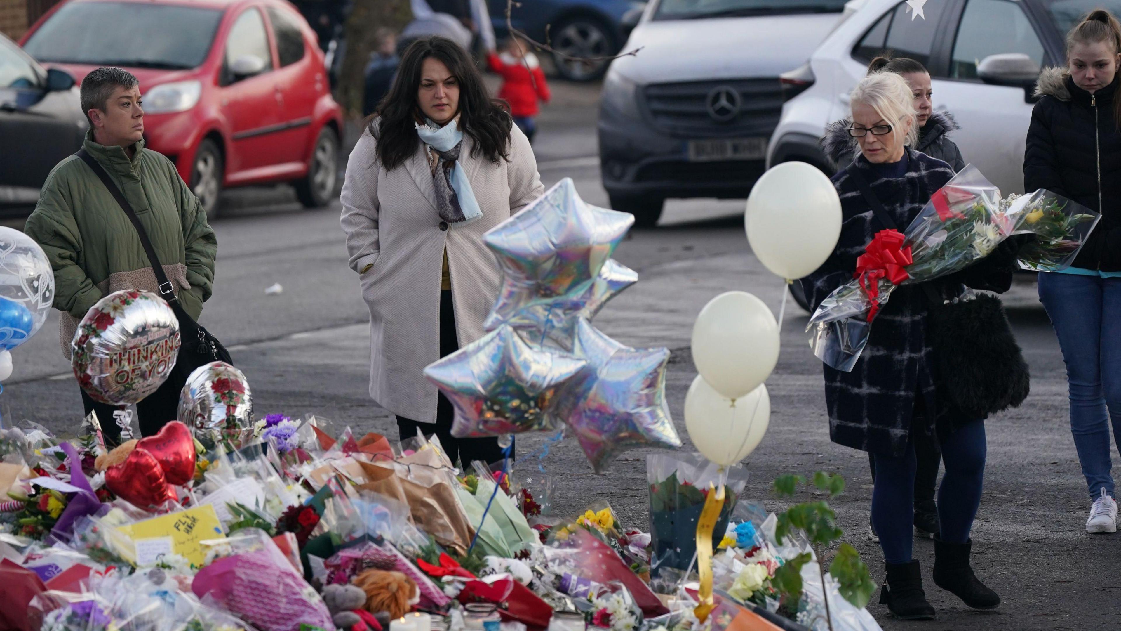 Tributes left at the scene of the Babbs Mill tragedy