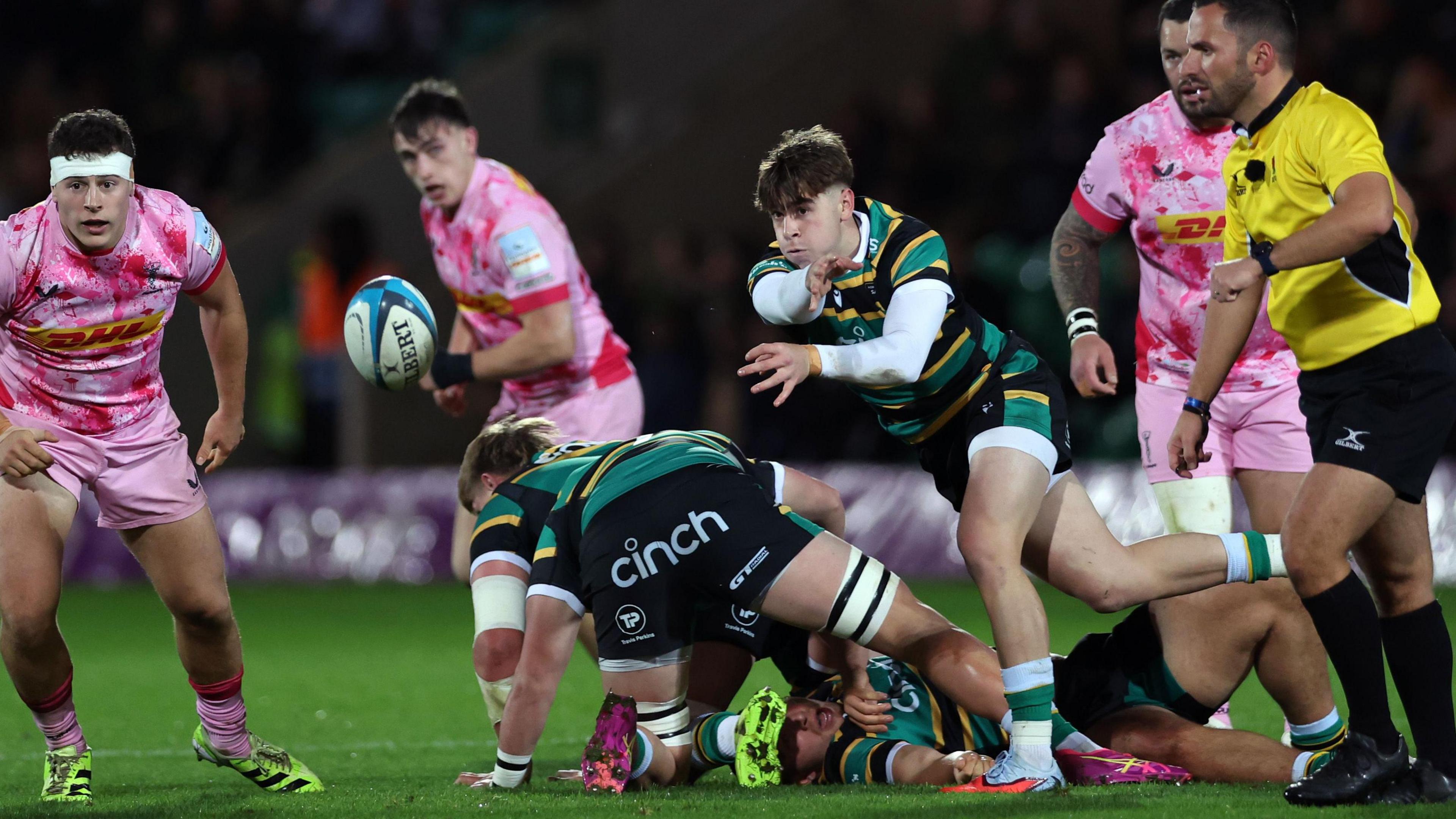 Jonny Weimann passes the ball during the PREM Rugby Cup match between Northampton Saints and Harlequins