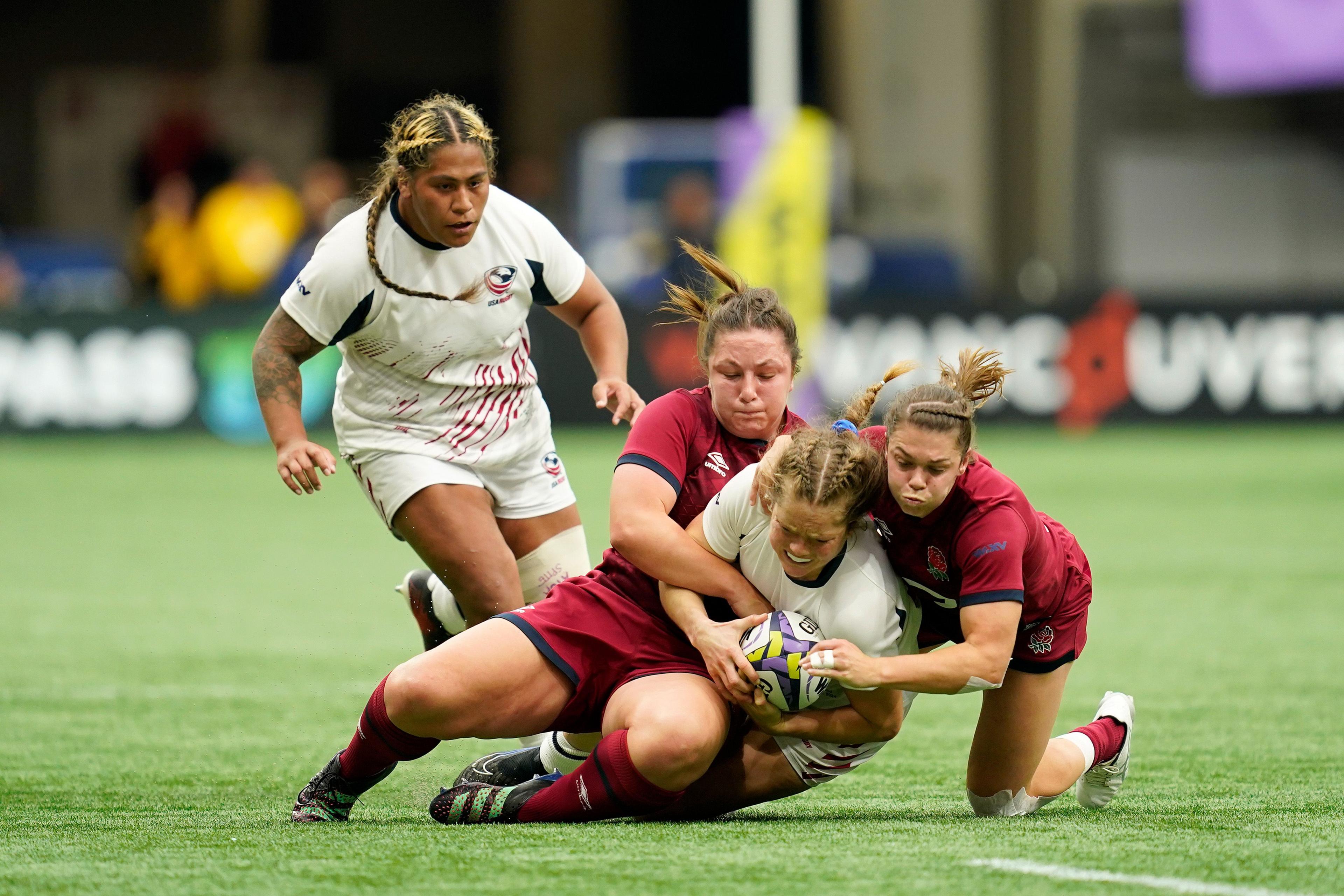 Amy Cokayne makes a tackle with Helena Rowland