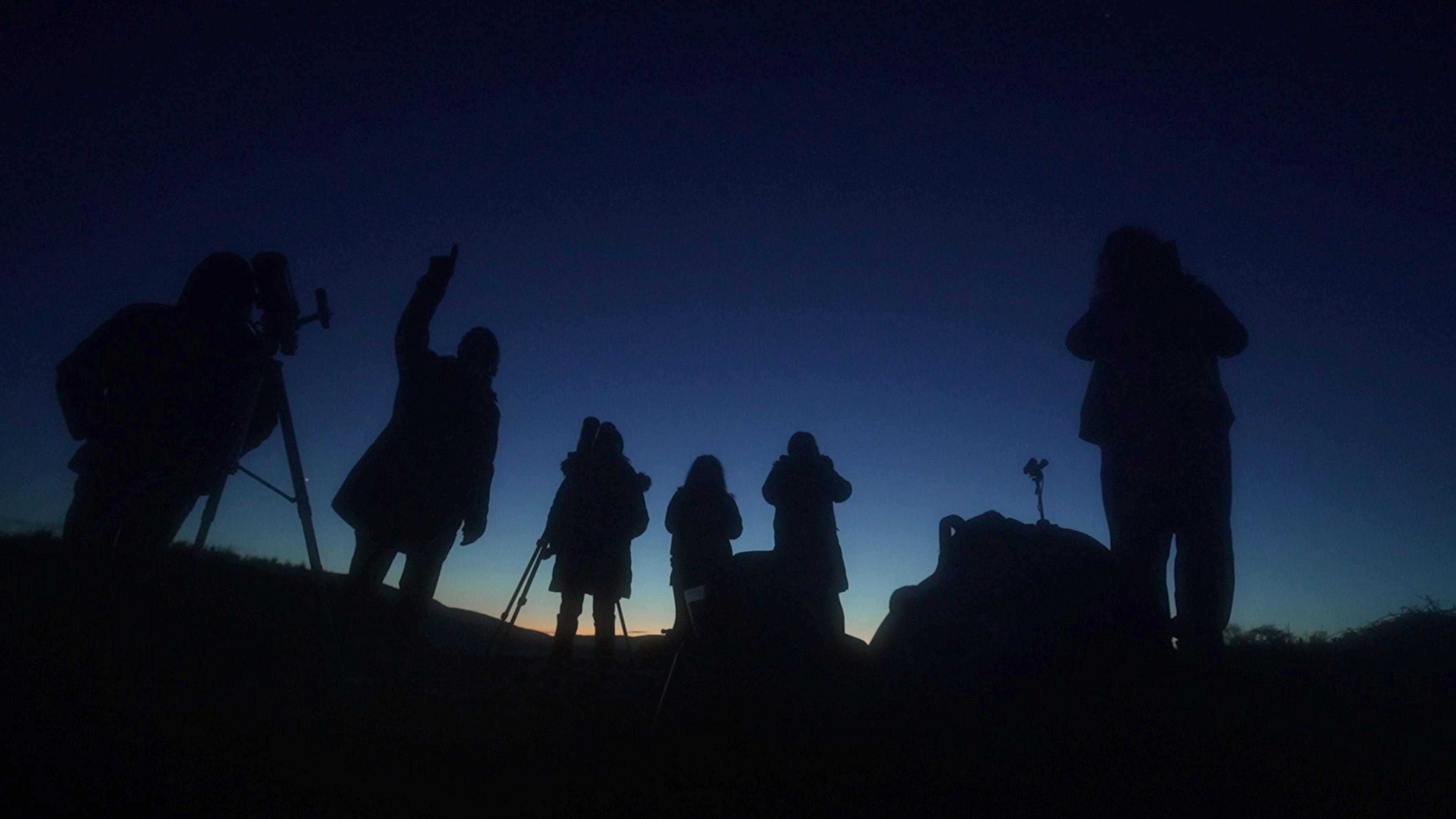 Astronomers looking at sky in the Dark Skies Reserve of Bannau Brycheiniog in south Wales