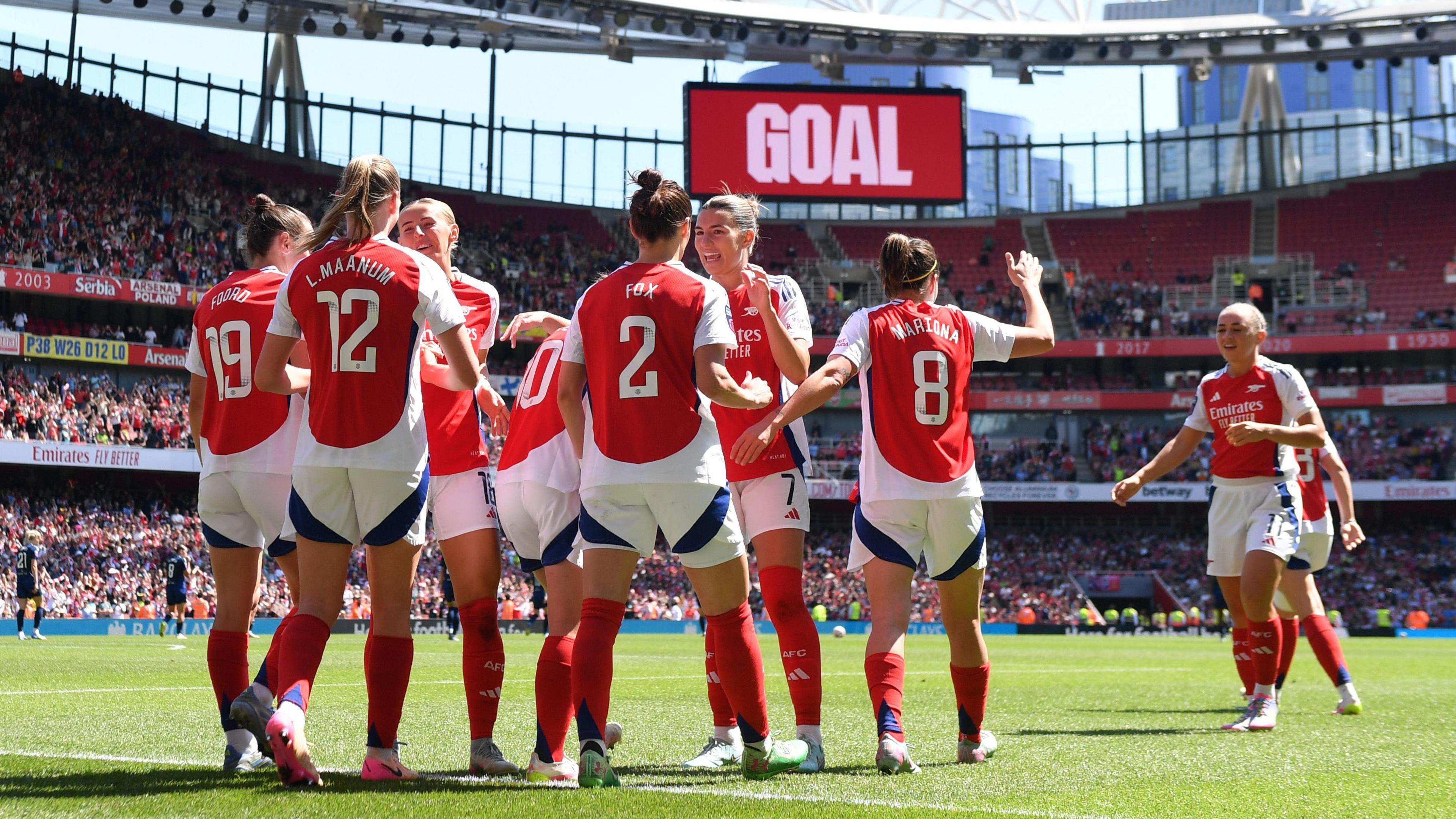 Arsenal women celebrate scoring a goal at Emirates Stadium