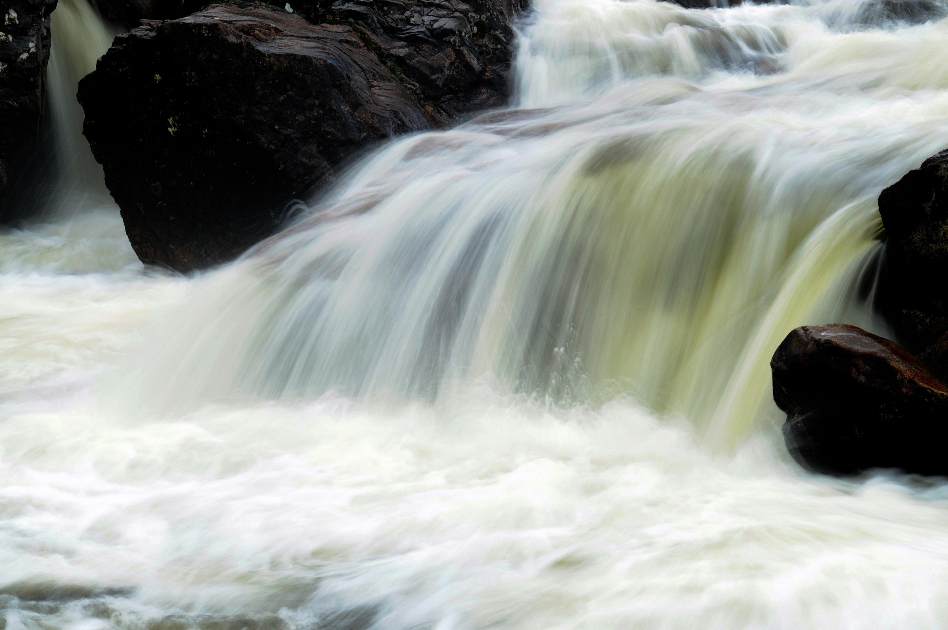 Slow shutter speed image of a waterfall giving a smokey/blurred effect