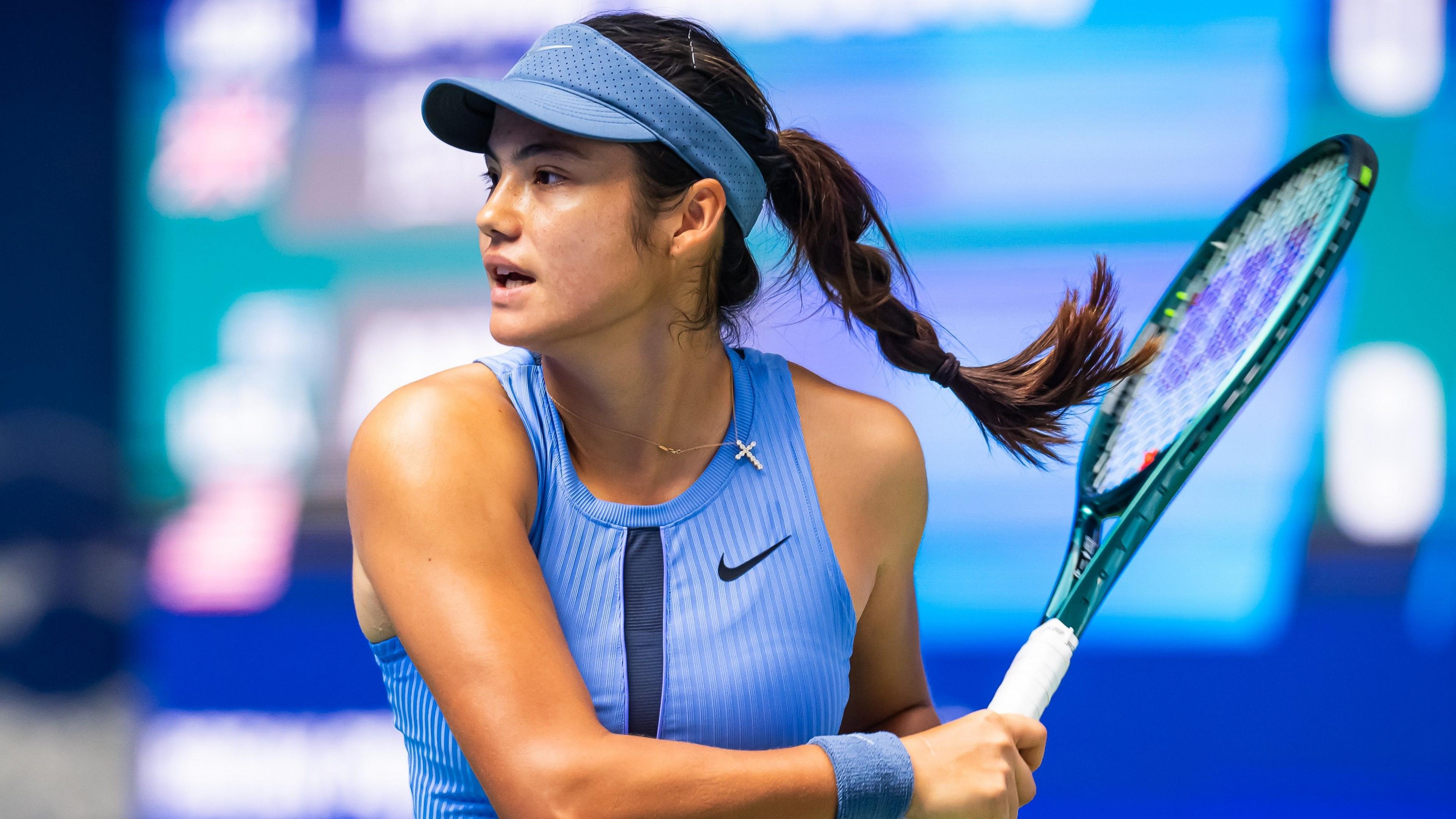 Emma Raducanu hits a forehand