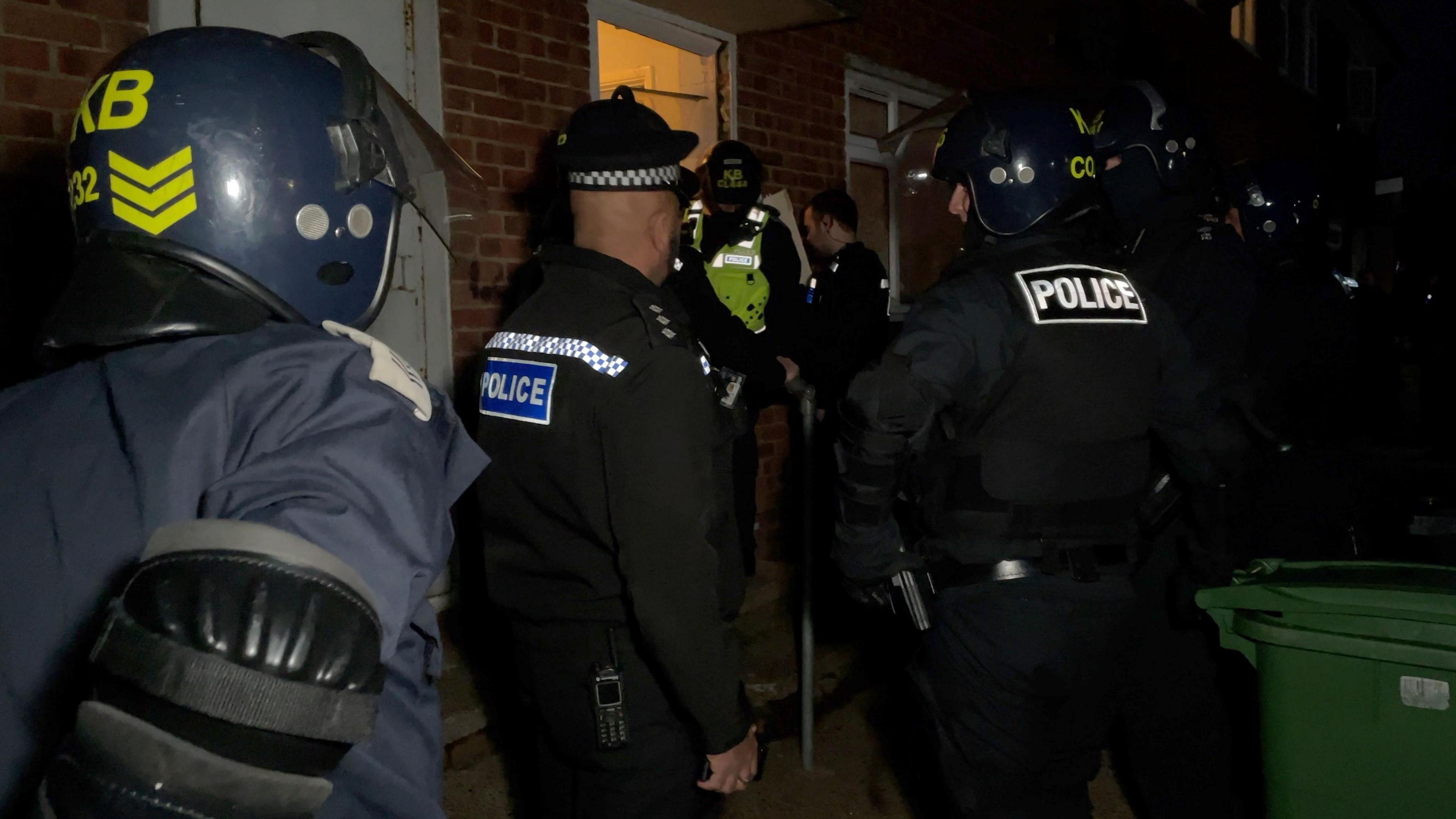 Police officers carrying out a drugs raid on a property in Hastings