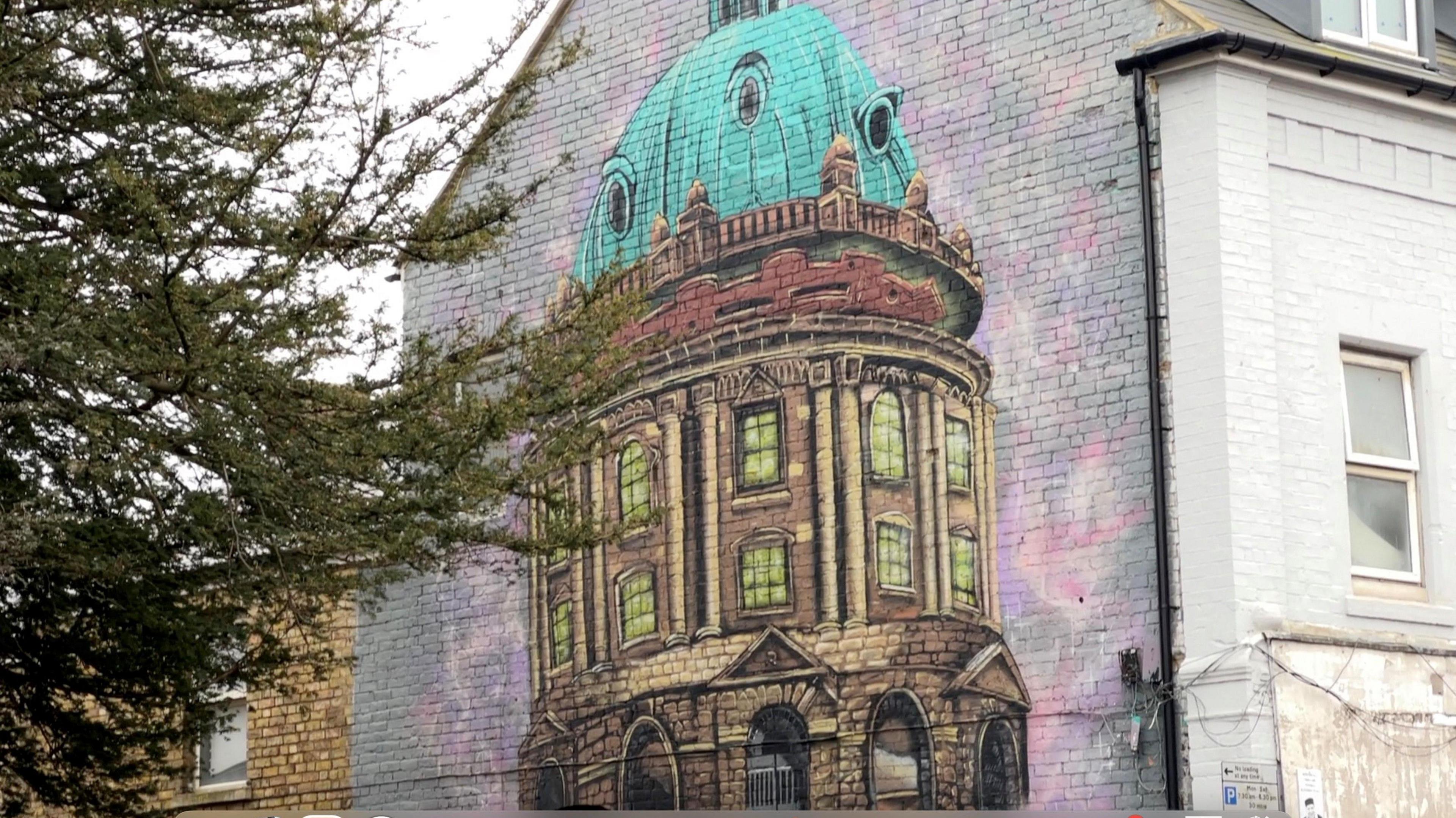 Graffiti of Oxford's Radcliffe Camera on the side of a building on Cowley Road.  