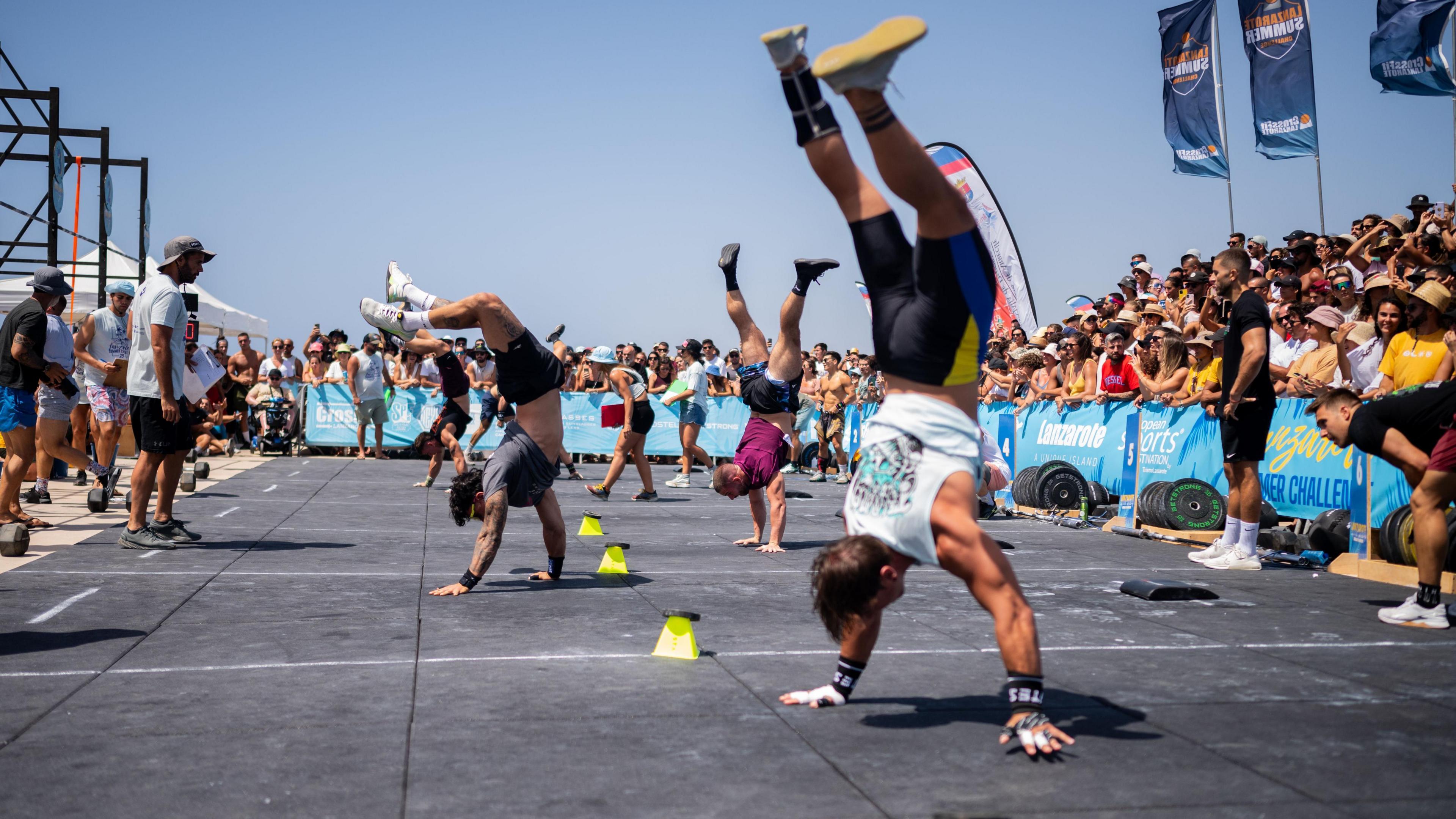 People do handstands in a CrossFit competition