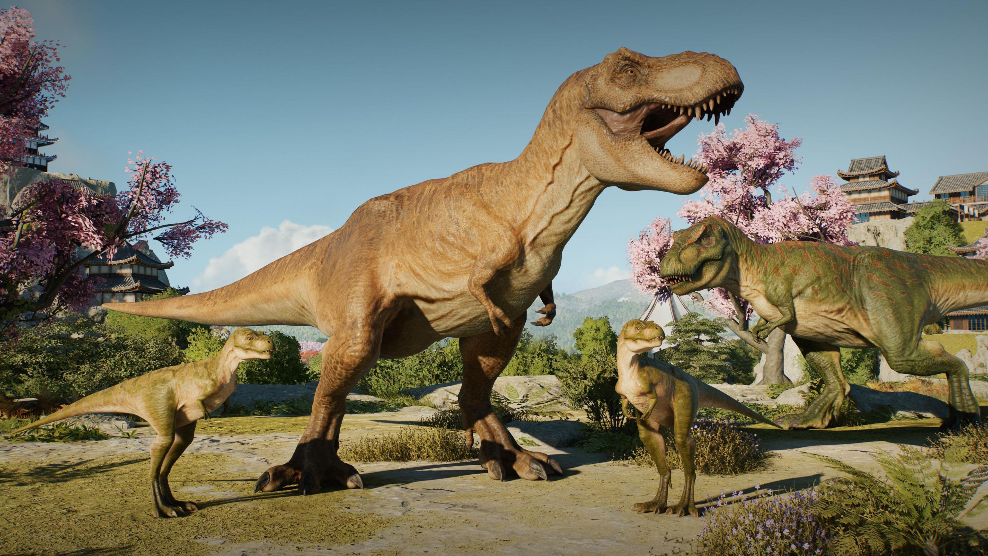 A screenshot from a video game showing four dinosaurs including one T-rex roaring in front of cherry trees with pink blossoms