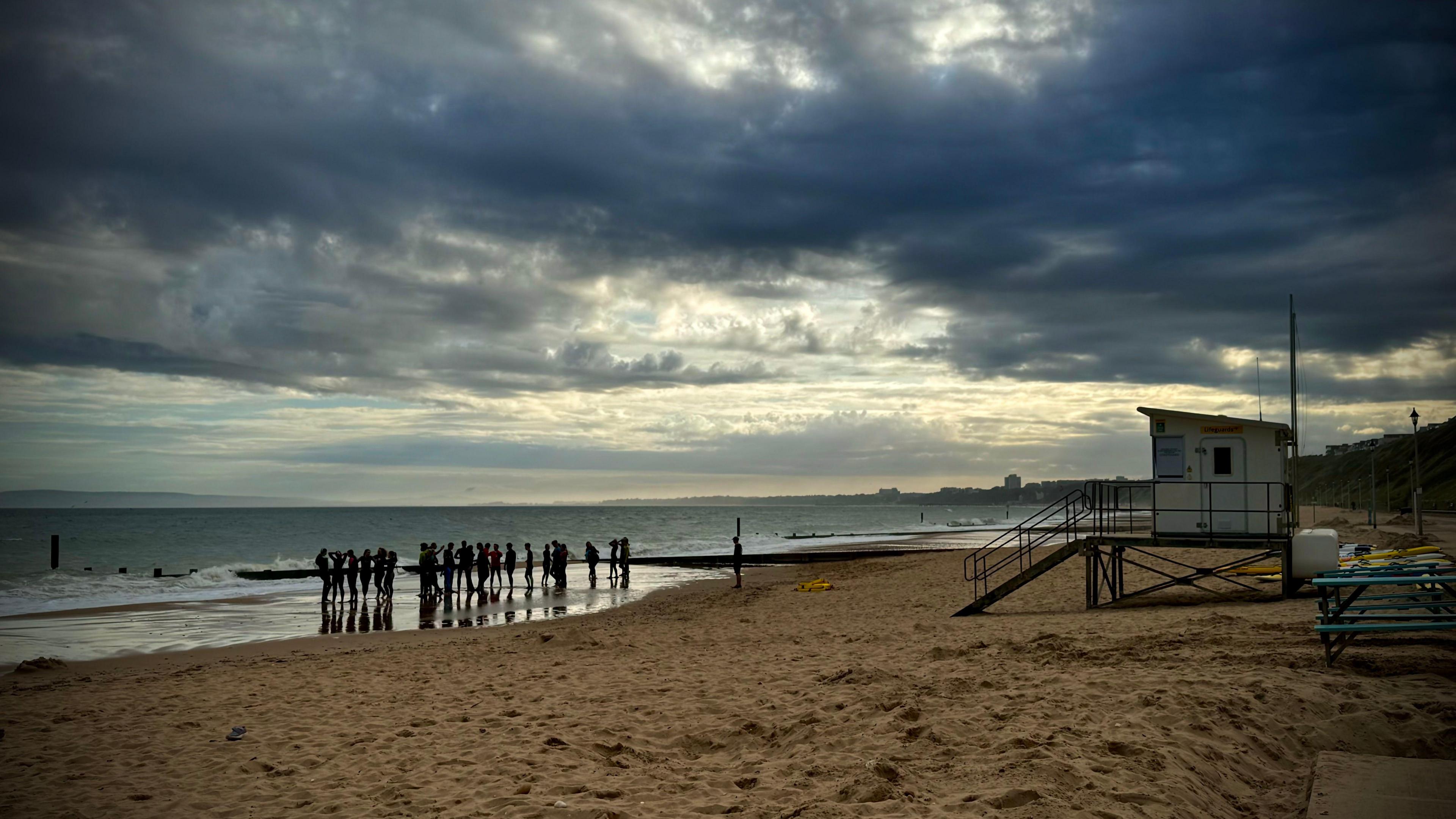 SATURDAY - Stormy Clouds over surfers on Southbourne Beach