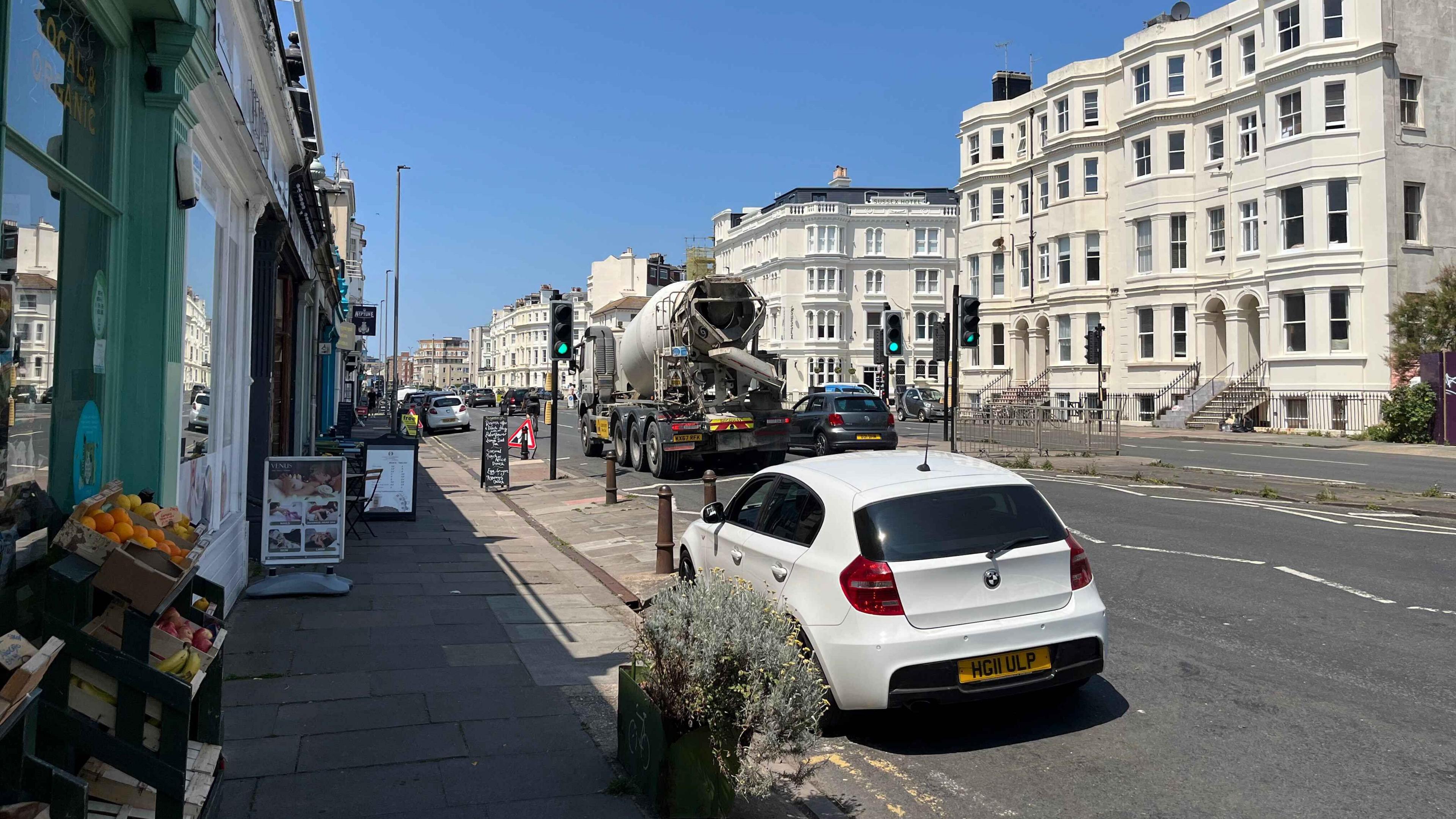 The A259 in hove which has a parade of independent shops with fruit and signage outside. There are currently two lanes which would go down to one lane