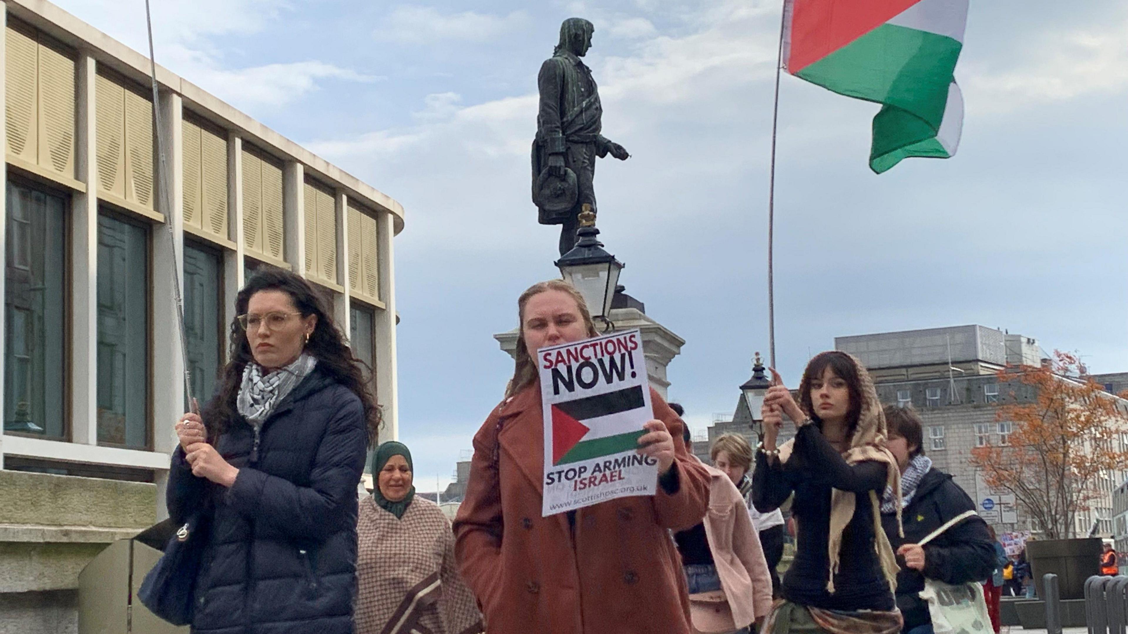 Protesters march during a pro-Palestinians demonstration to mark the first anniversary of the war in Gaza on October 05, 2024 in Aberdeen.