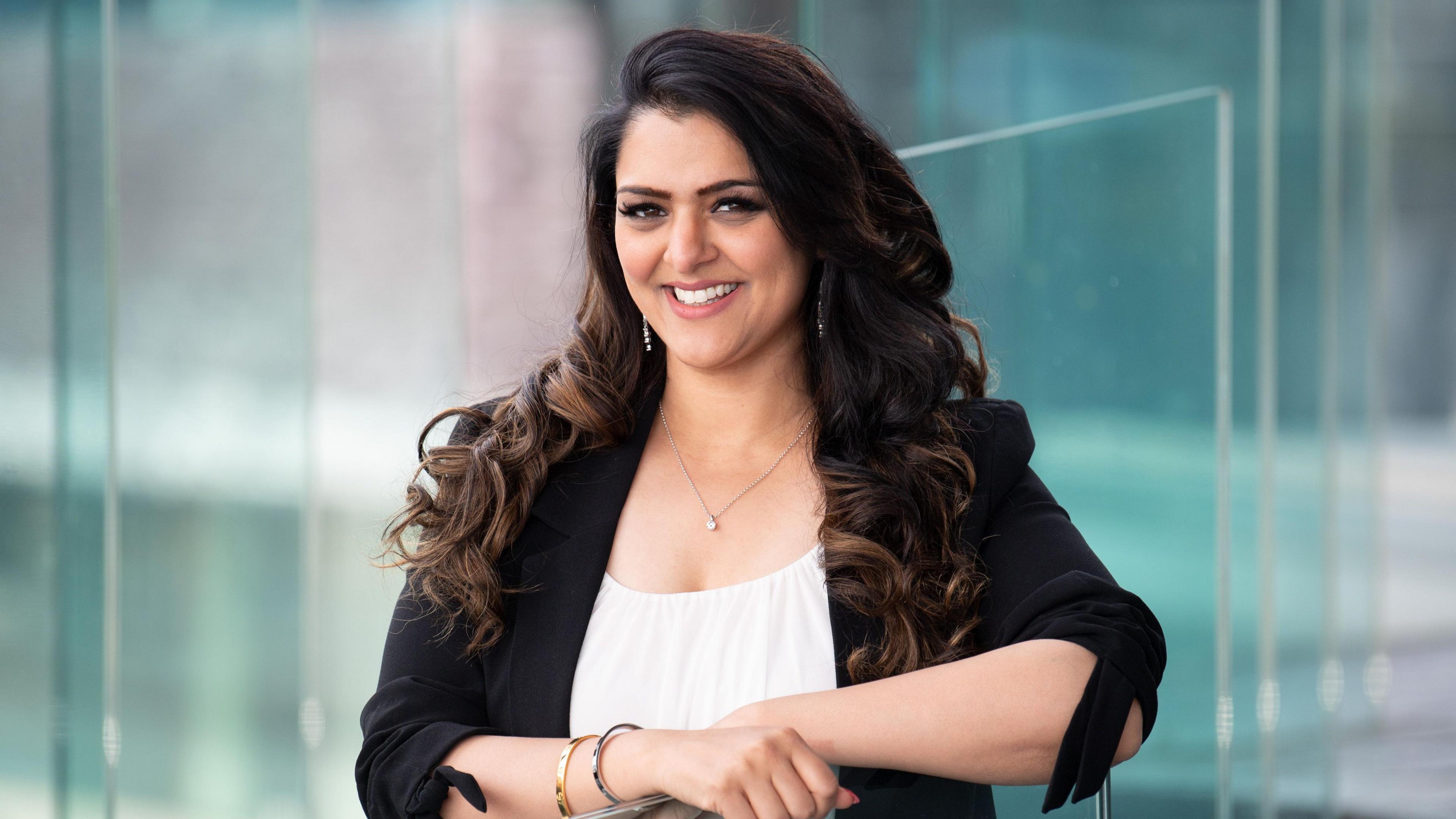 Natasha Asghar stood on the steps of the Senedd building in Cardiff Bay