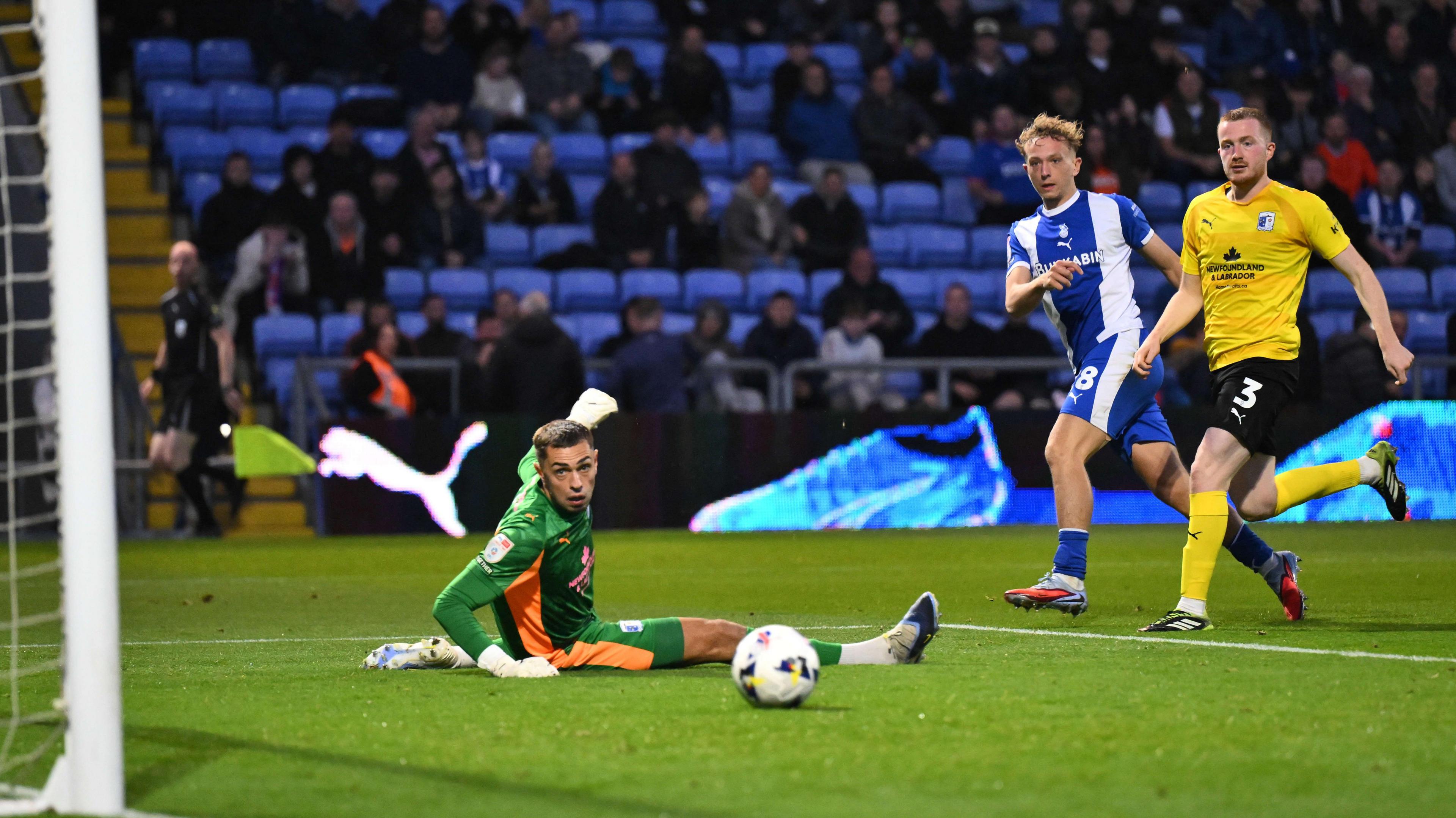 Michael Mellon of Oldham Athletic sees his shot hit the post