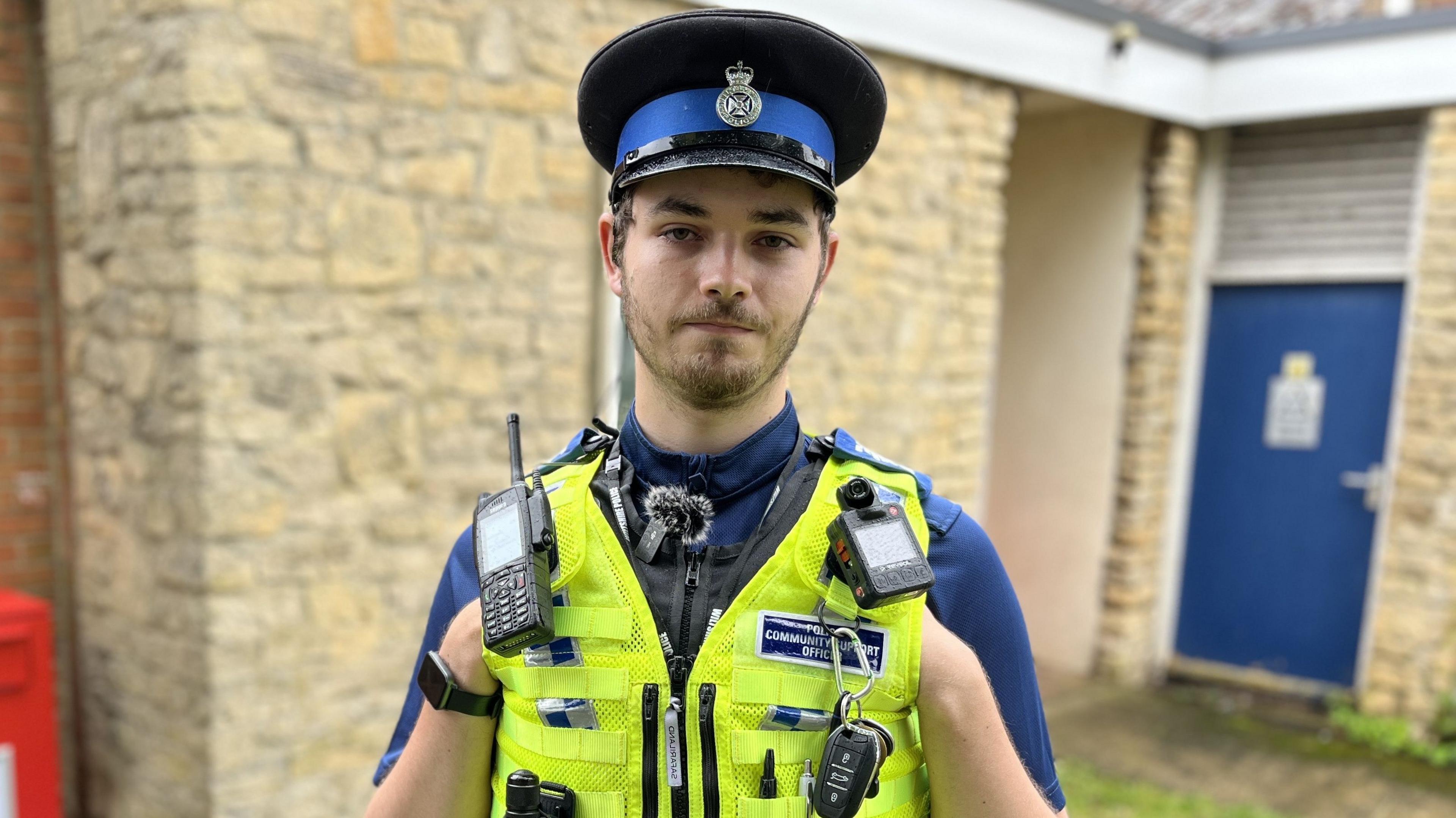 PCSO Euan Passmore wearing his hat and police vest