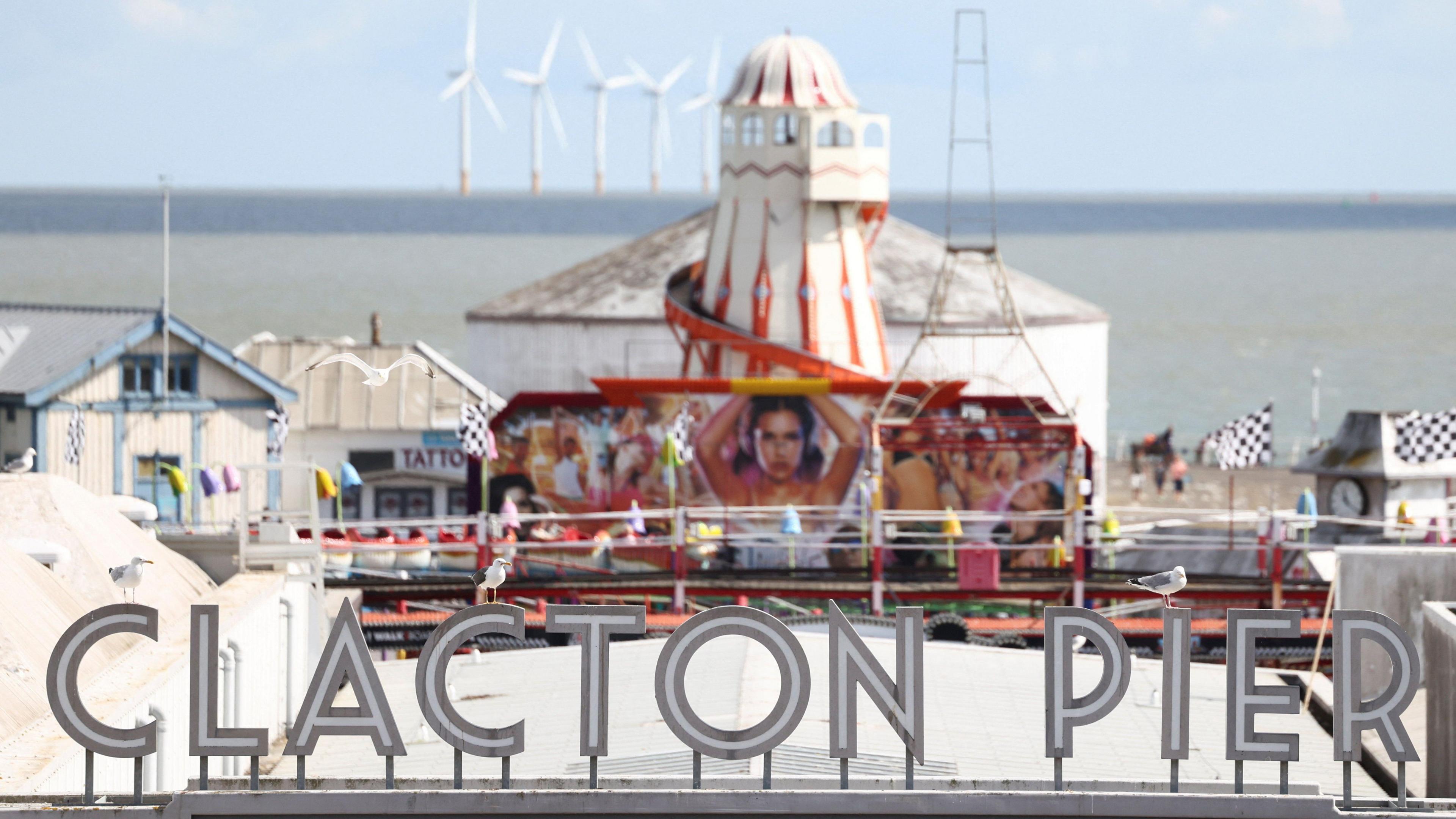 Clacton Pier with helter-skelter and rides in the distance