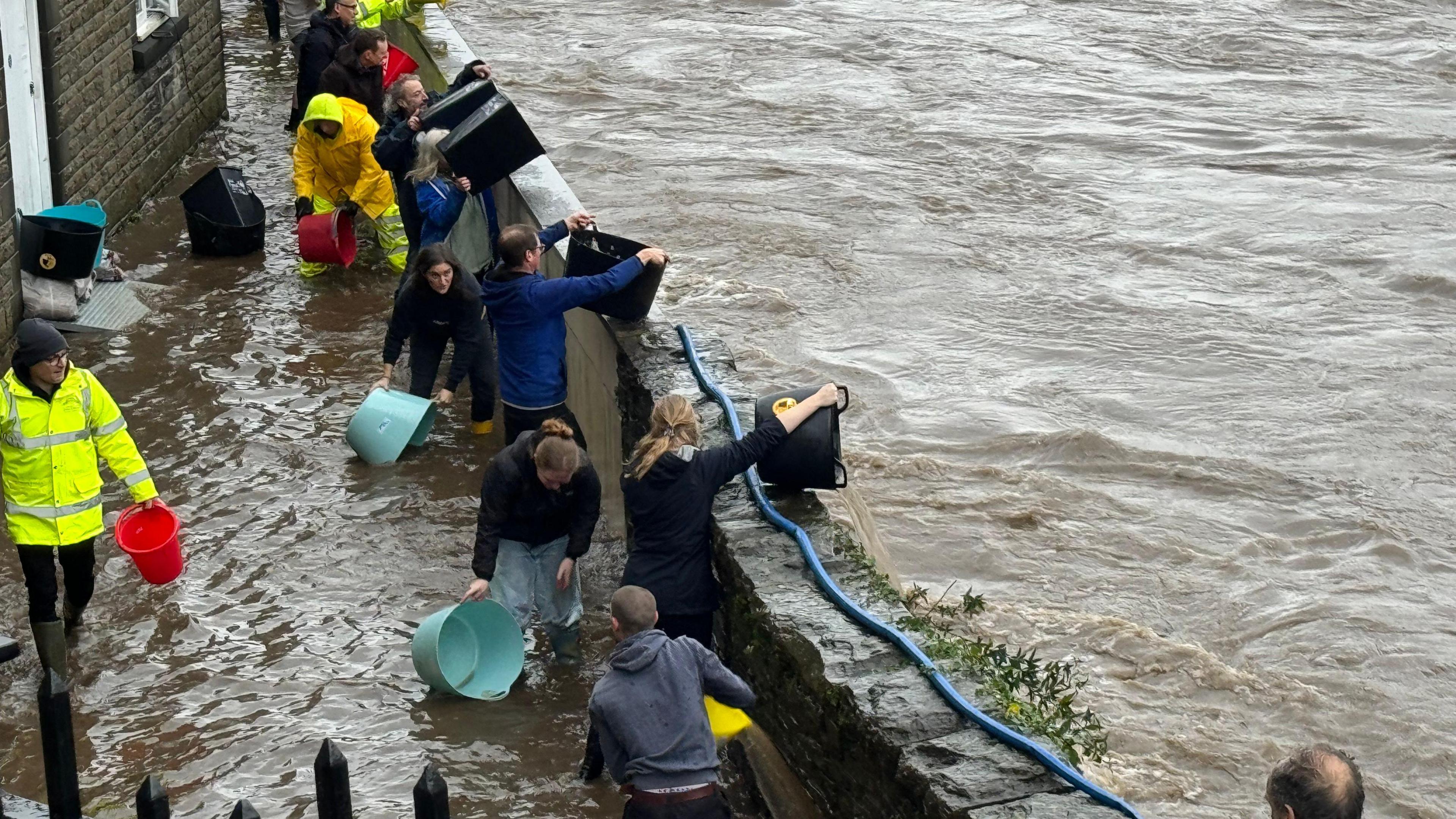 Pontypridd residents bail out their houses after flooding 