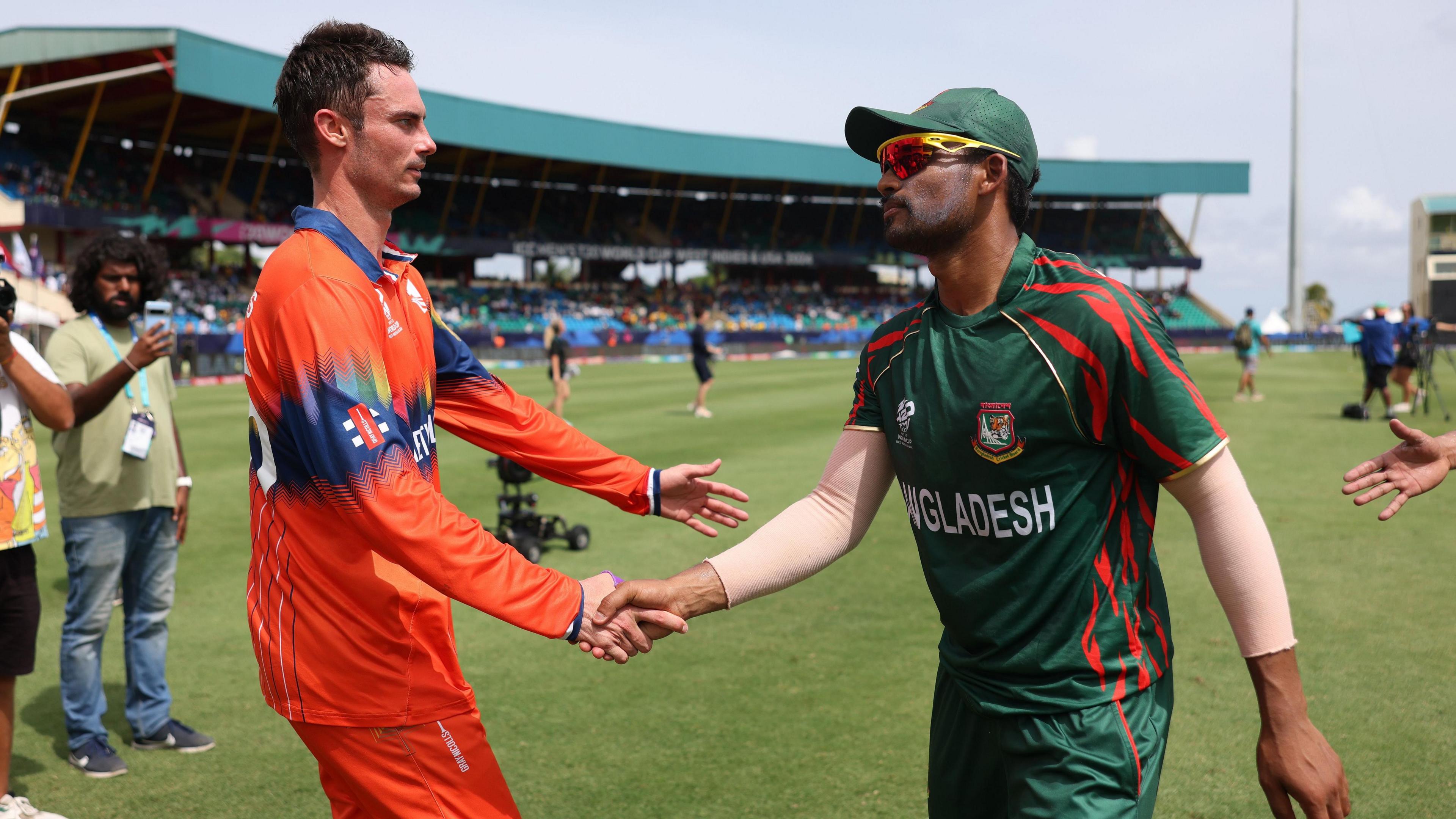 The Netherlands' Scott Edwards and Bangladesh's Nazmul Hossain Shanto shake hands in 2024