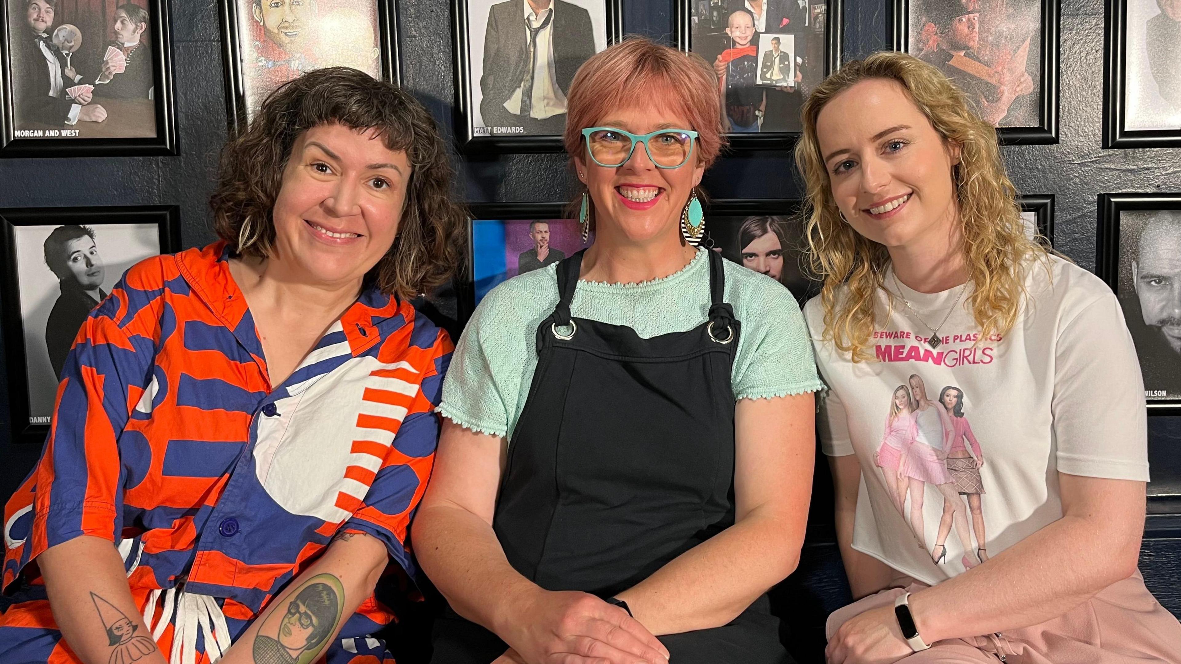 Comedians Amy Mason, Louise Leigh and Dani Johns sitting together and smiling