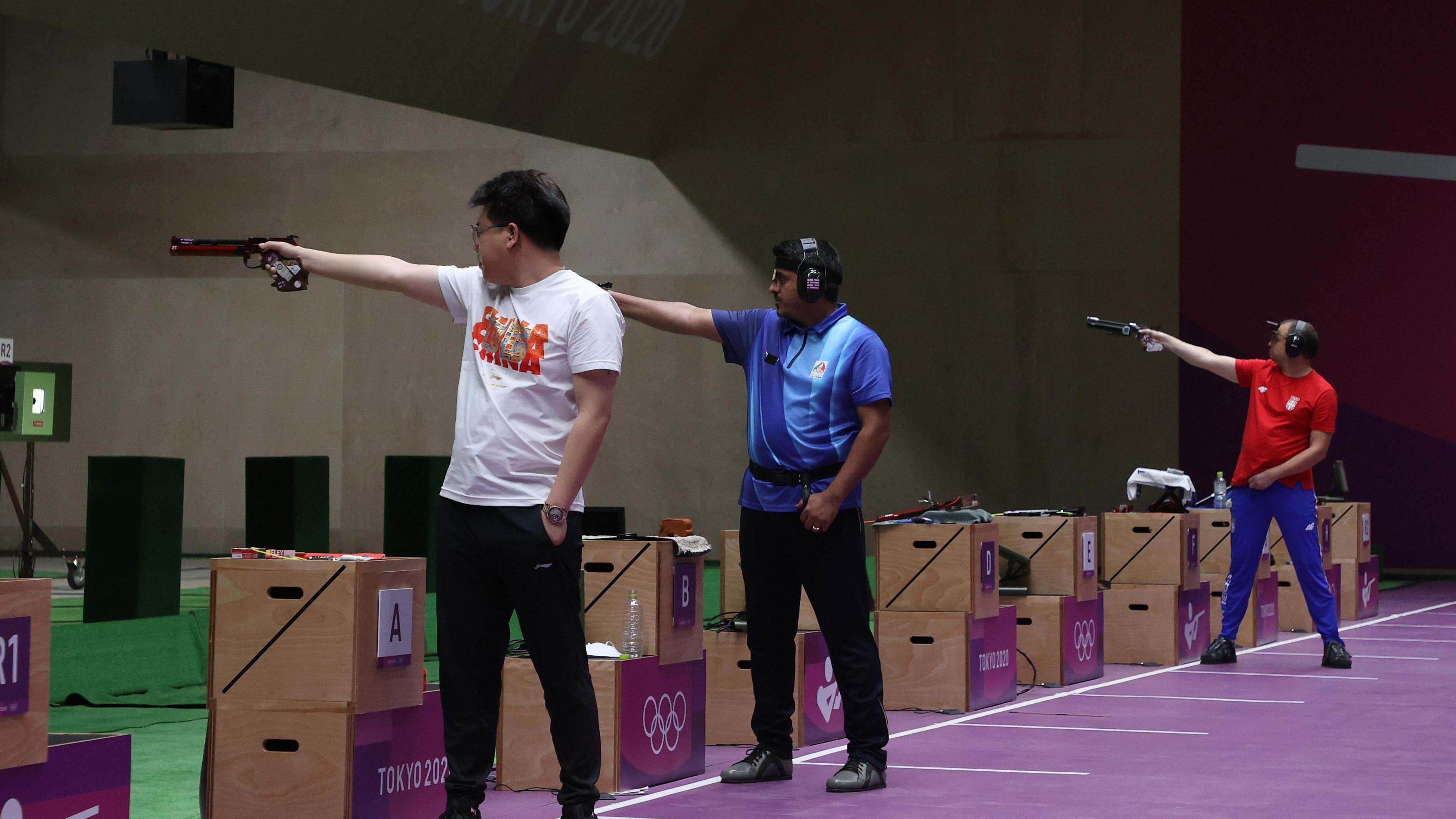 Wei Pang, Javad Foroughi and Damir Mikec are shooting at targets that are out of sight of the camera