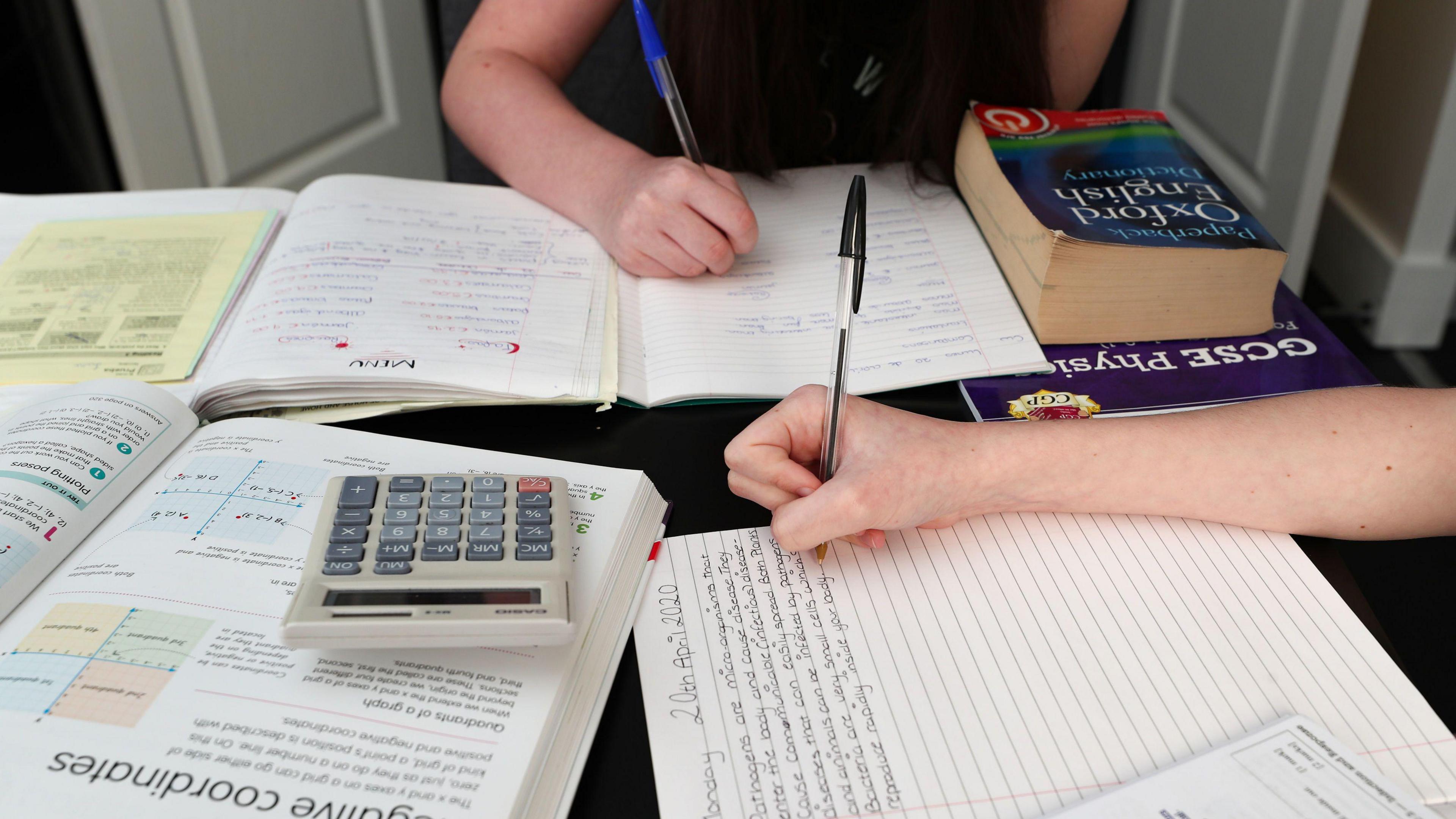 Children doing school work at home