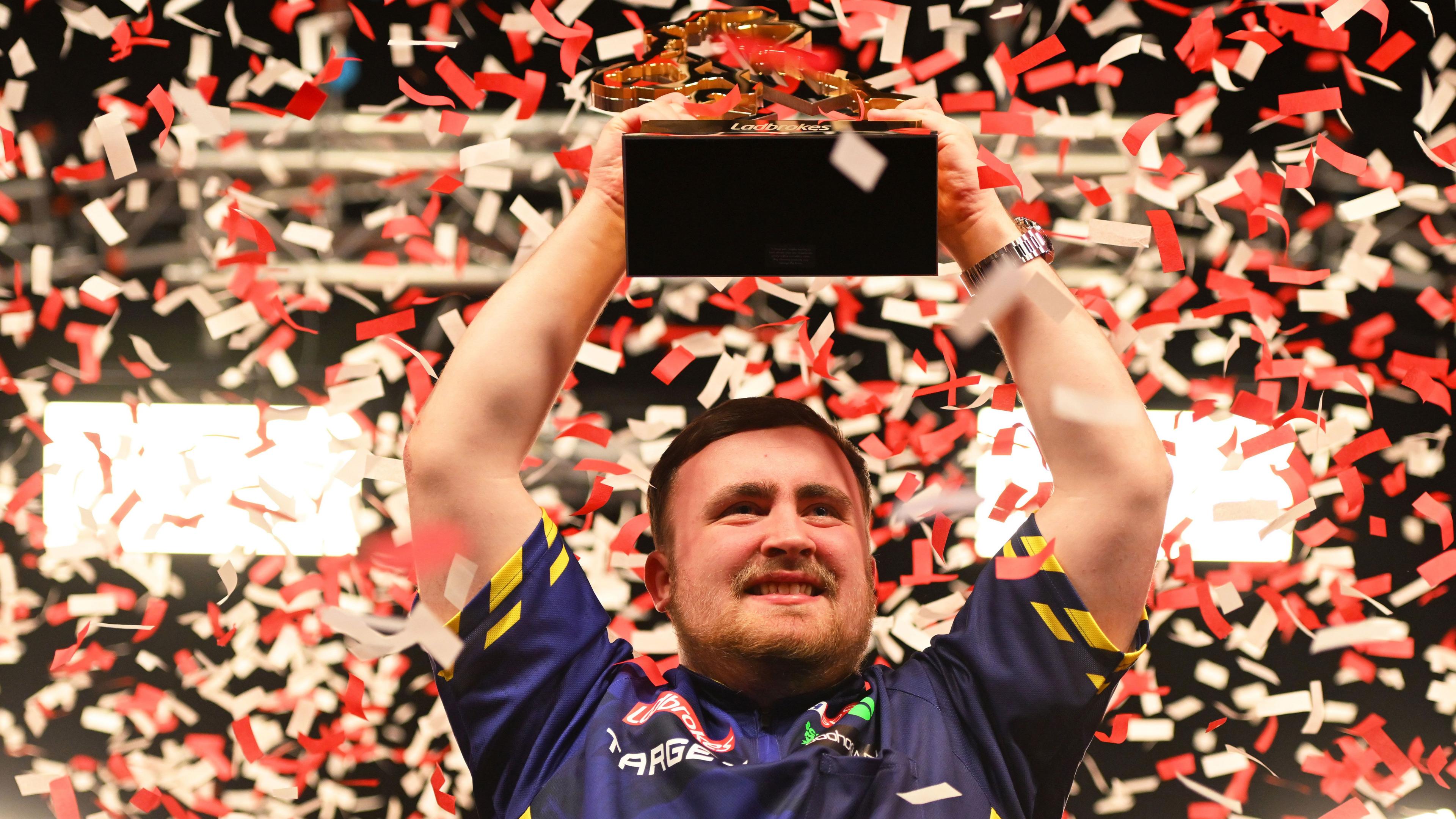 Luke Littler celebrates winning the UK Open