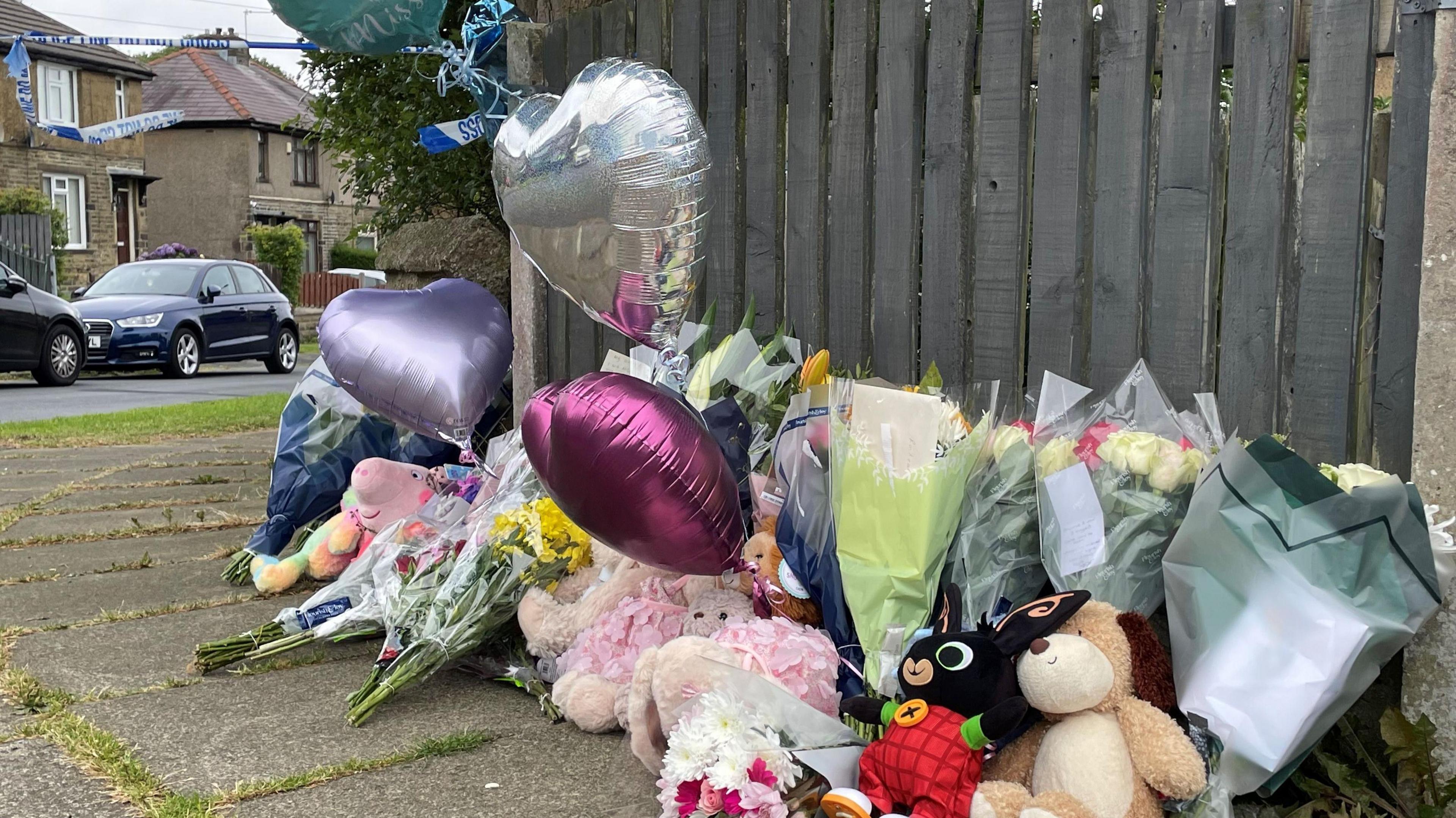 Flowers, balloons and toys left on the street 