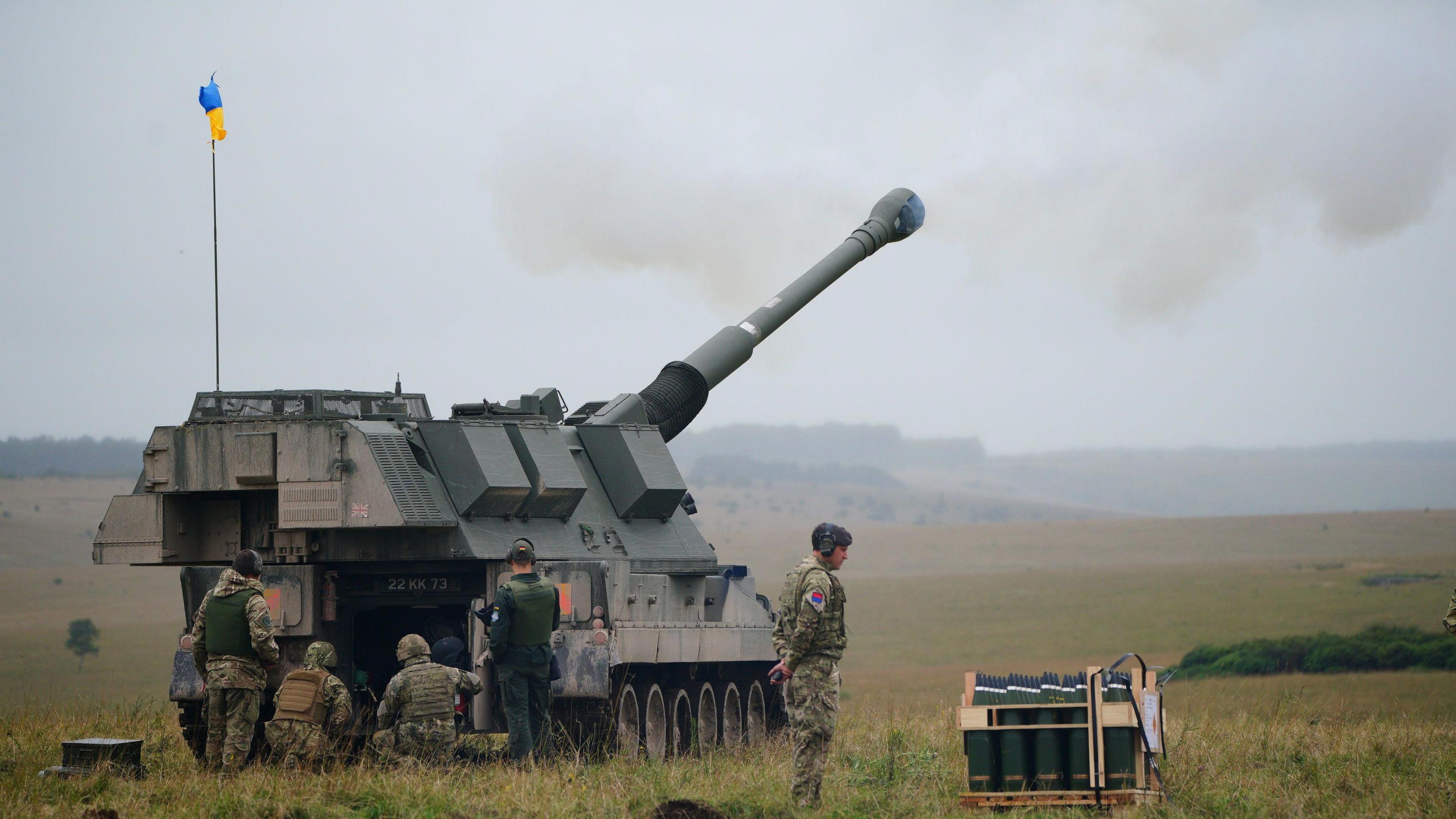 Newly trained Ukrainian artillery specialists firing British donated AS90 155mm self-propelled artillery guns under the supervision of British Army instructors