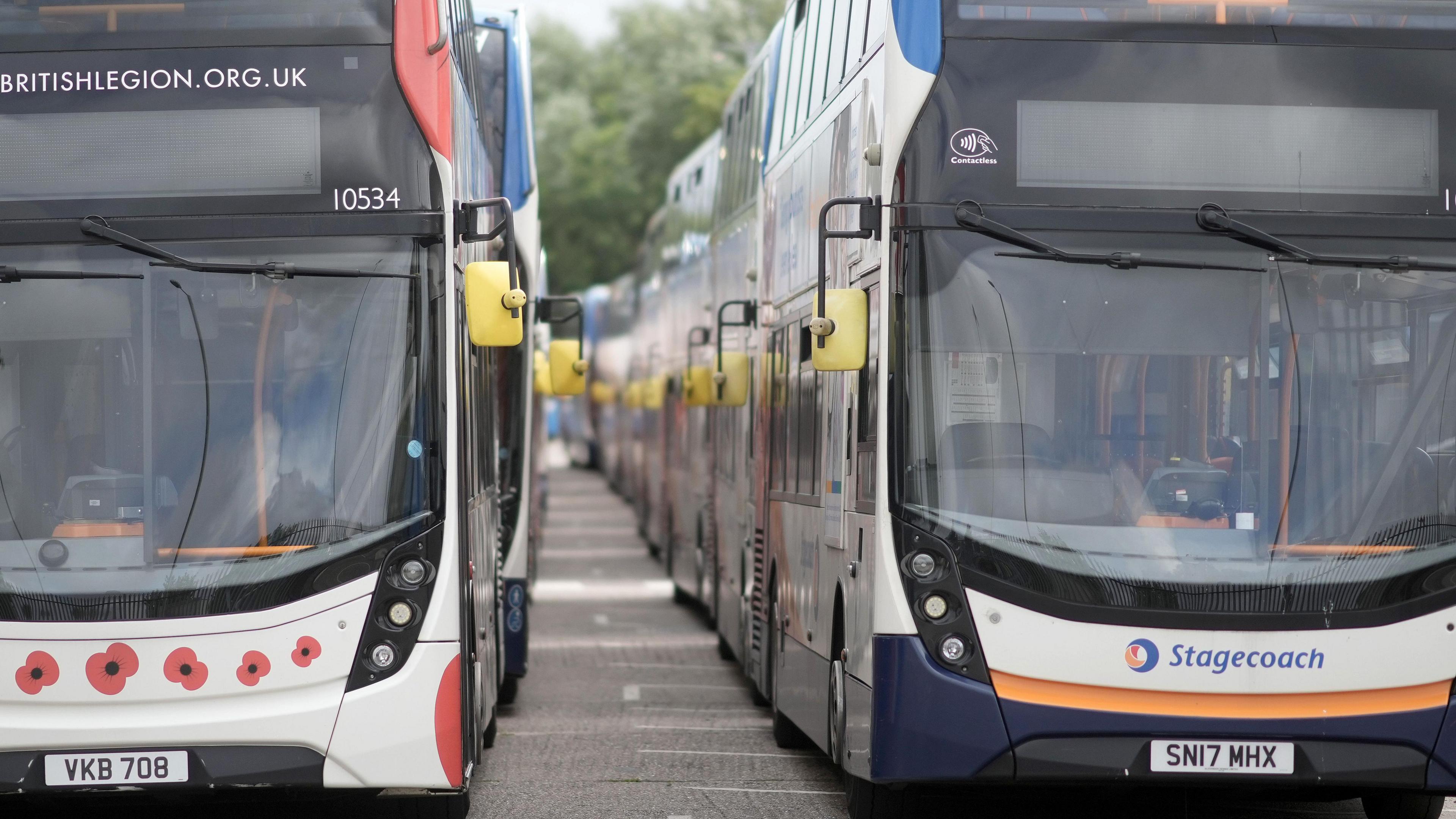 Two stagecoach buses parked alongside each other.