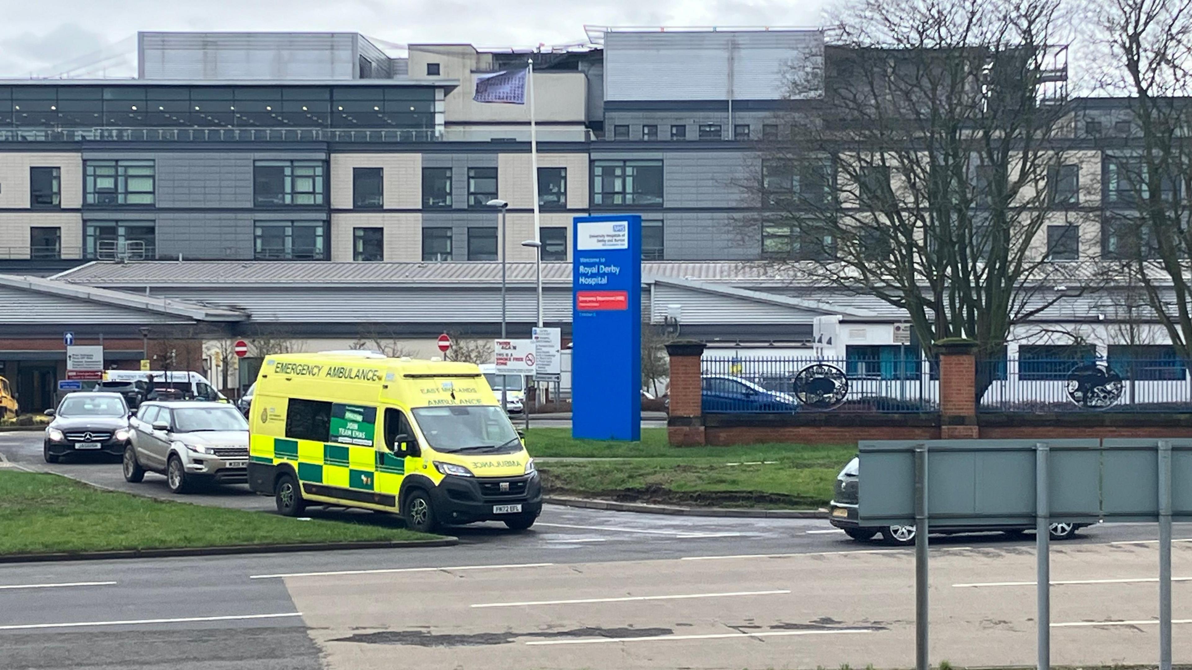 A general view of Royal Derby Hospital with an ambulance leaving the site.