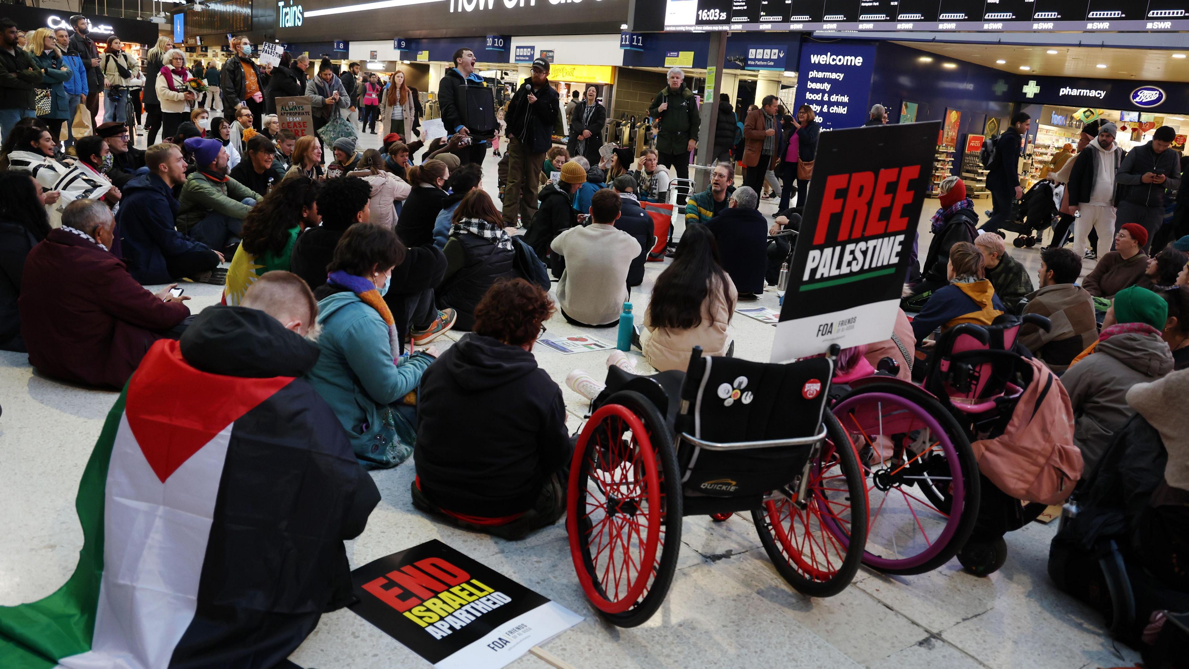 Pro-Palestine protestors during Waterloo station sit-in