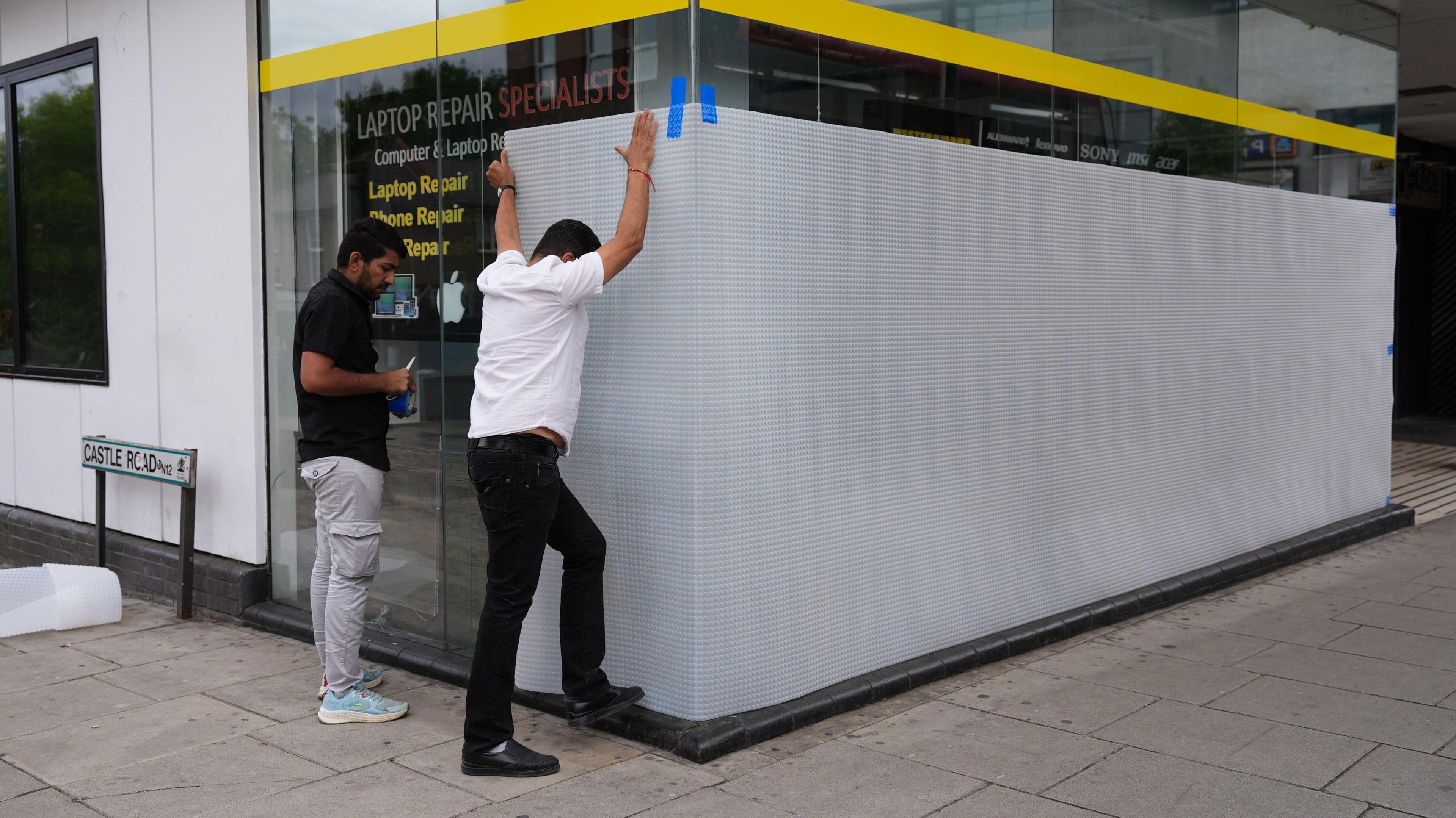 Shops being boarded up in North Finchley 