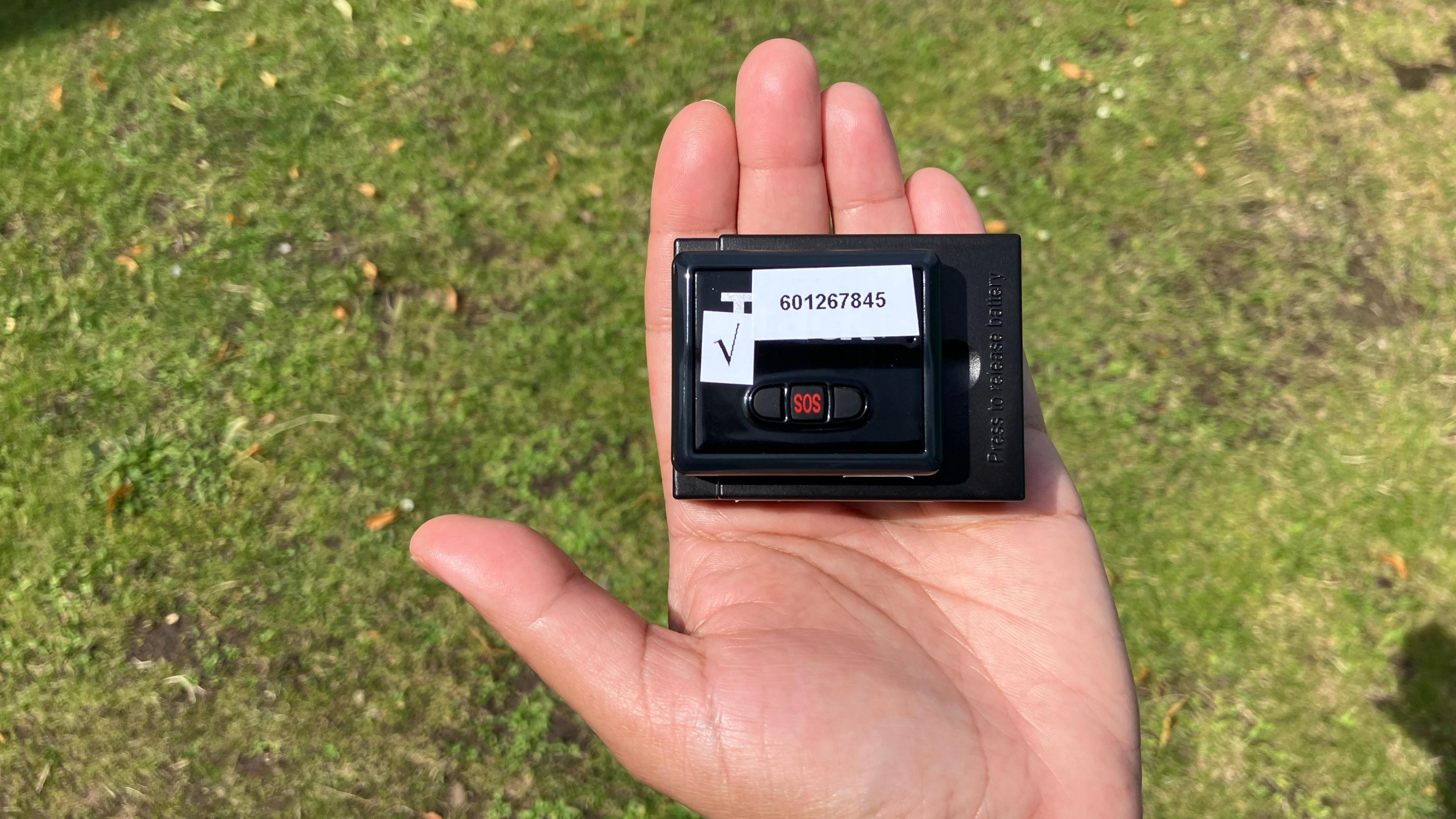 The tracker used in the study in a palm of hand