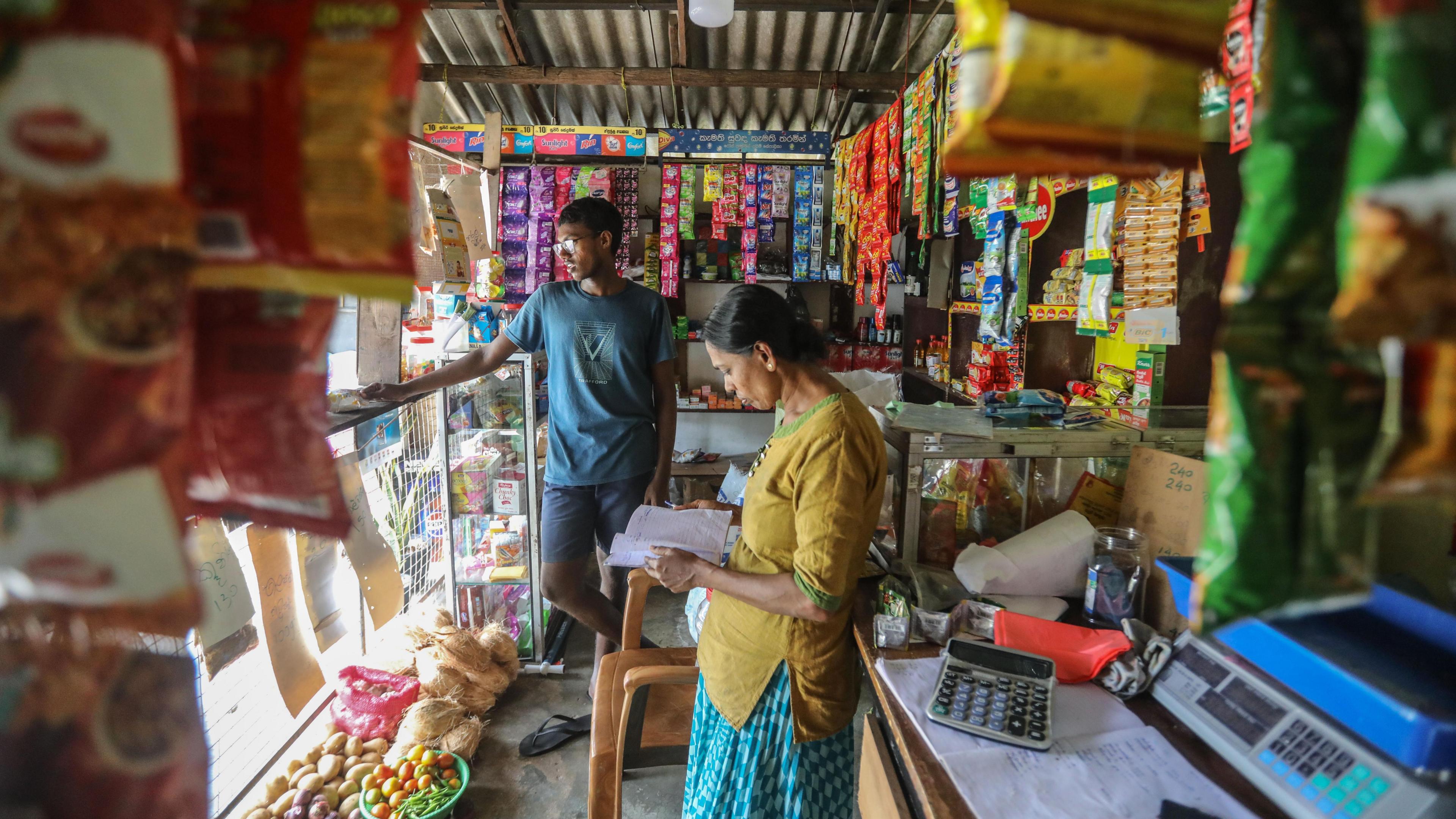 Vendors wait for customers at a grocery shop in Colombo, Sri Lanka, 13 September 2024.