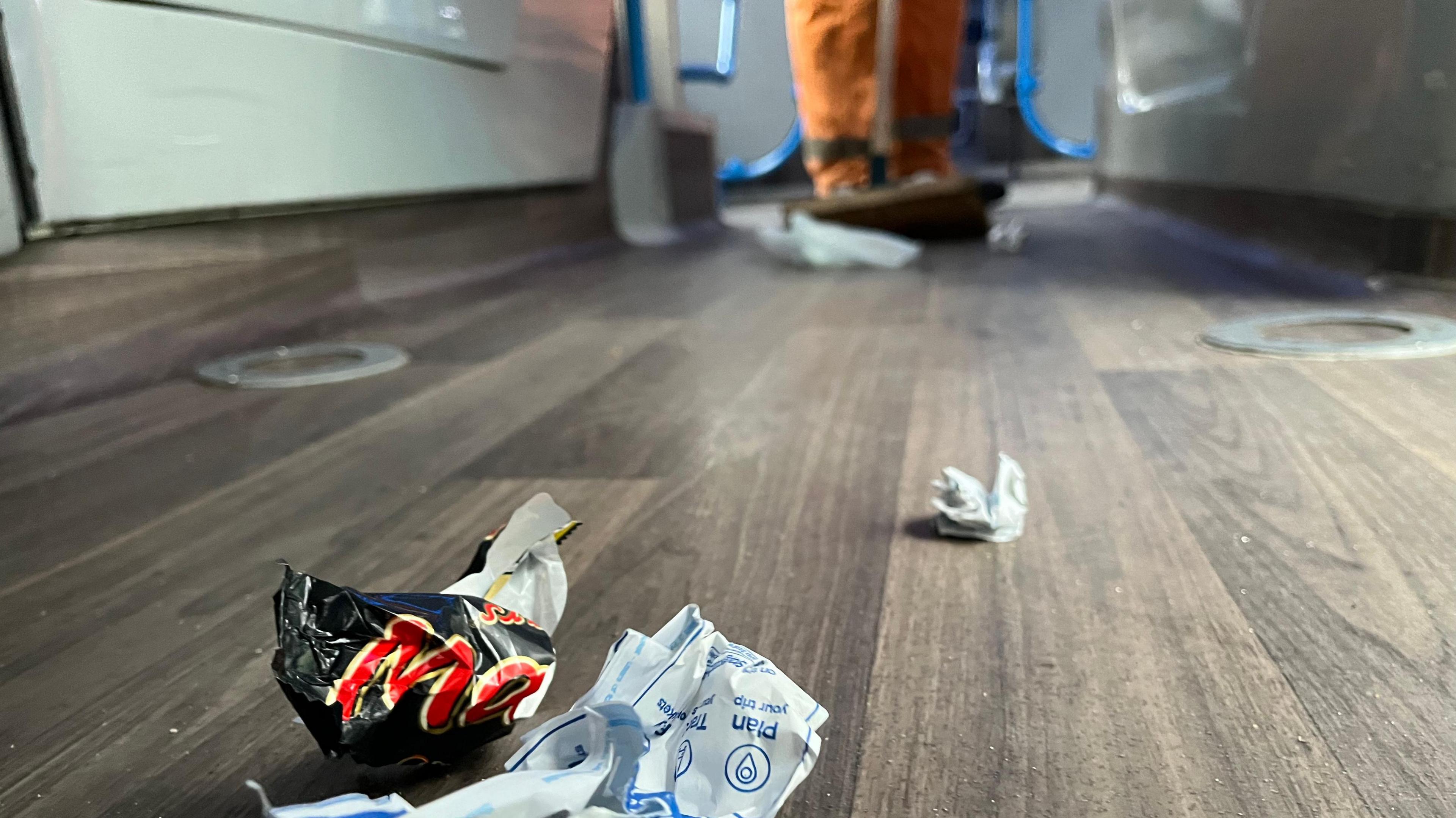 Sweeping up litter on a bus