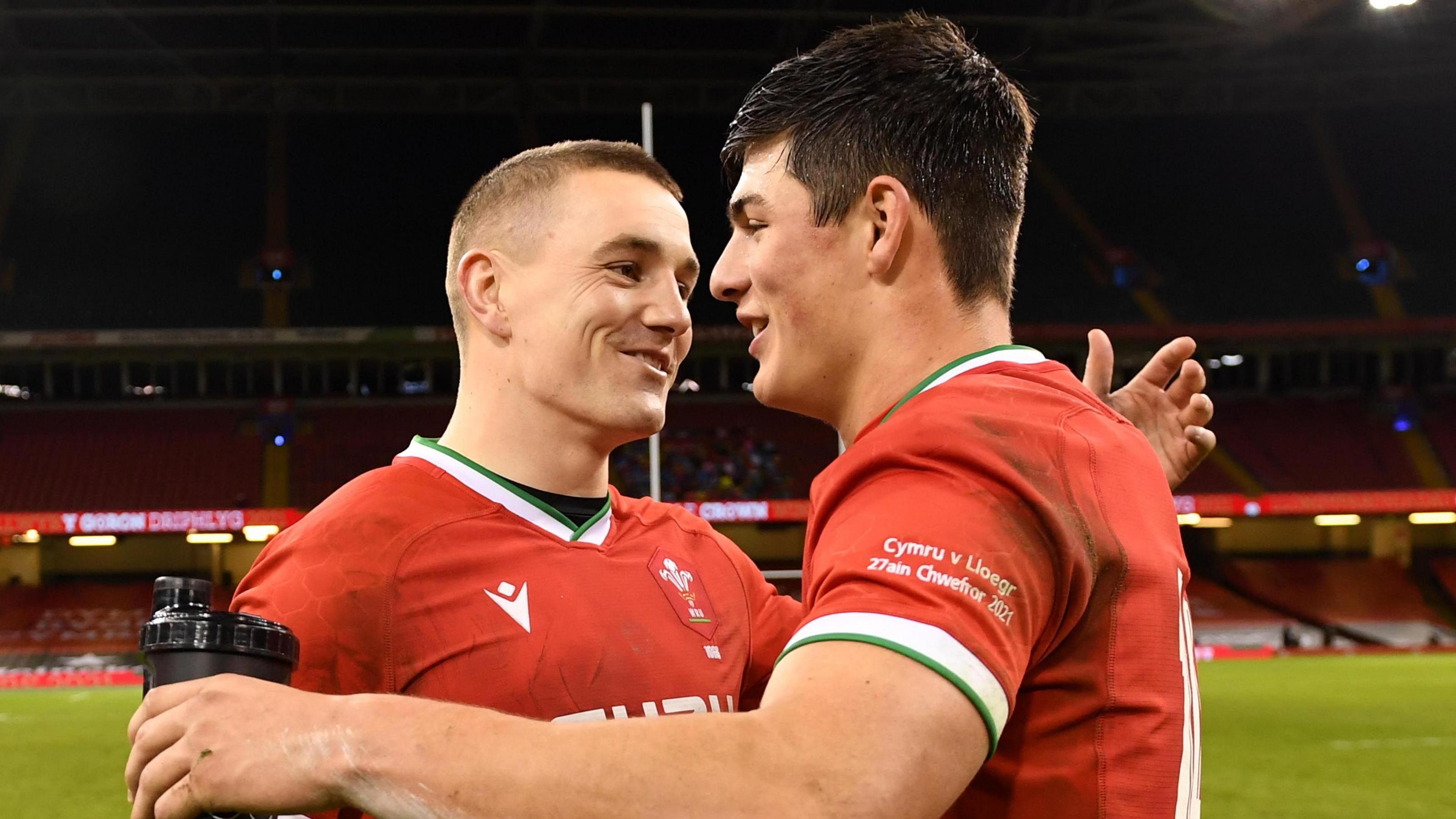 Jonathan Davies and Louis Rees-Zammit embrace after Wales' 2021 win against England