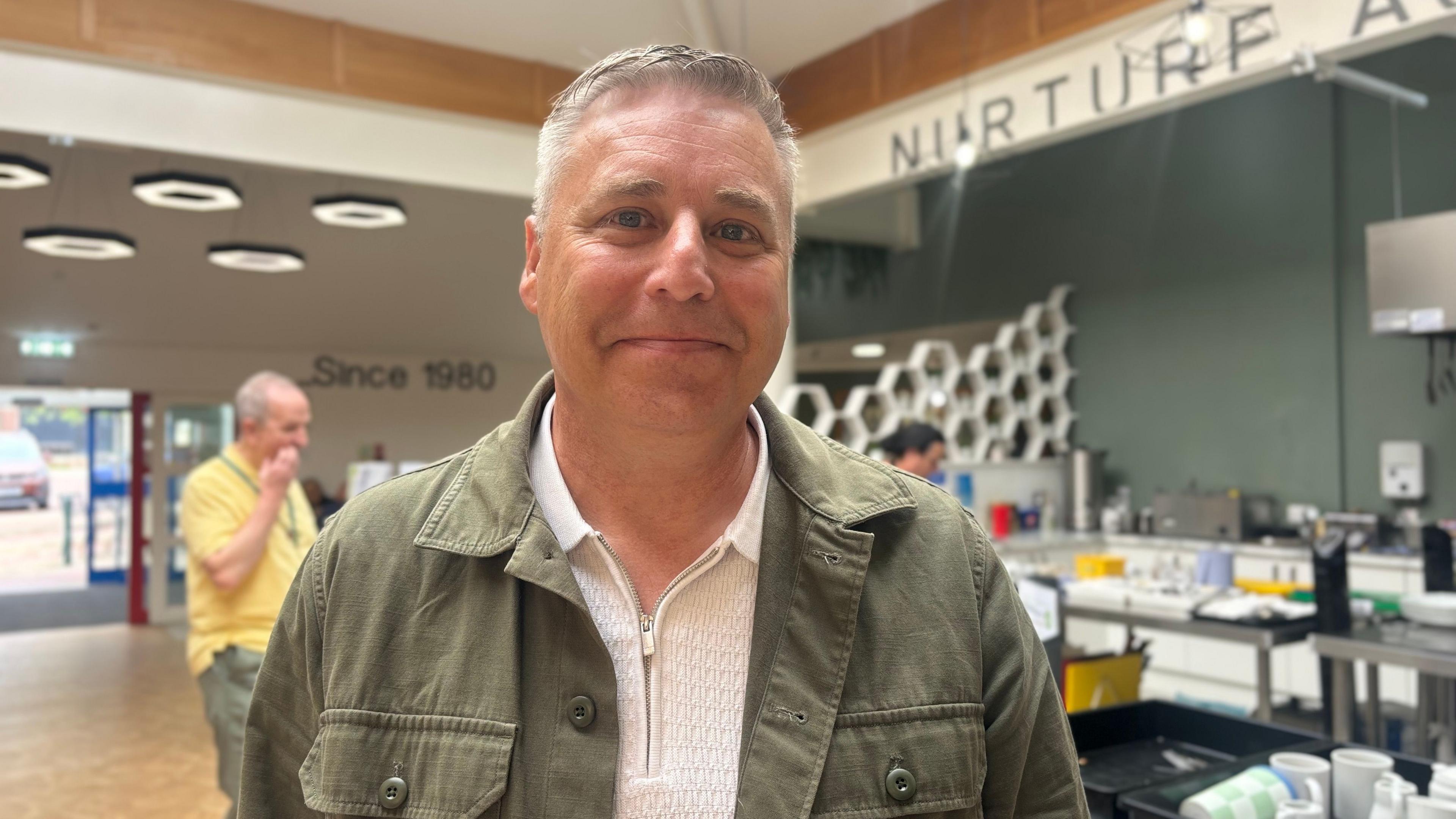 CEO Wayne Dobson standing in the bistro area at Cedarwood Trust in North Shields.