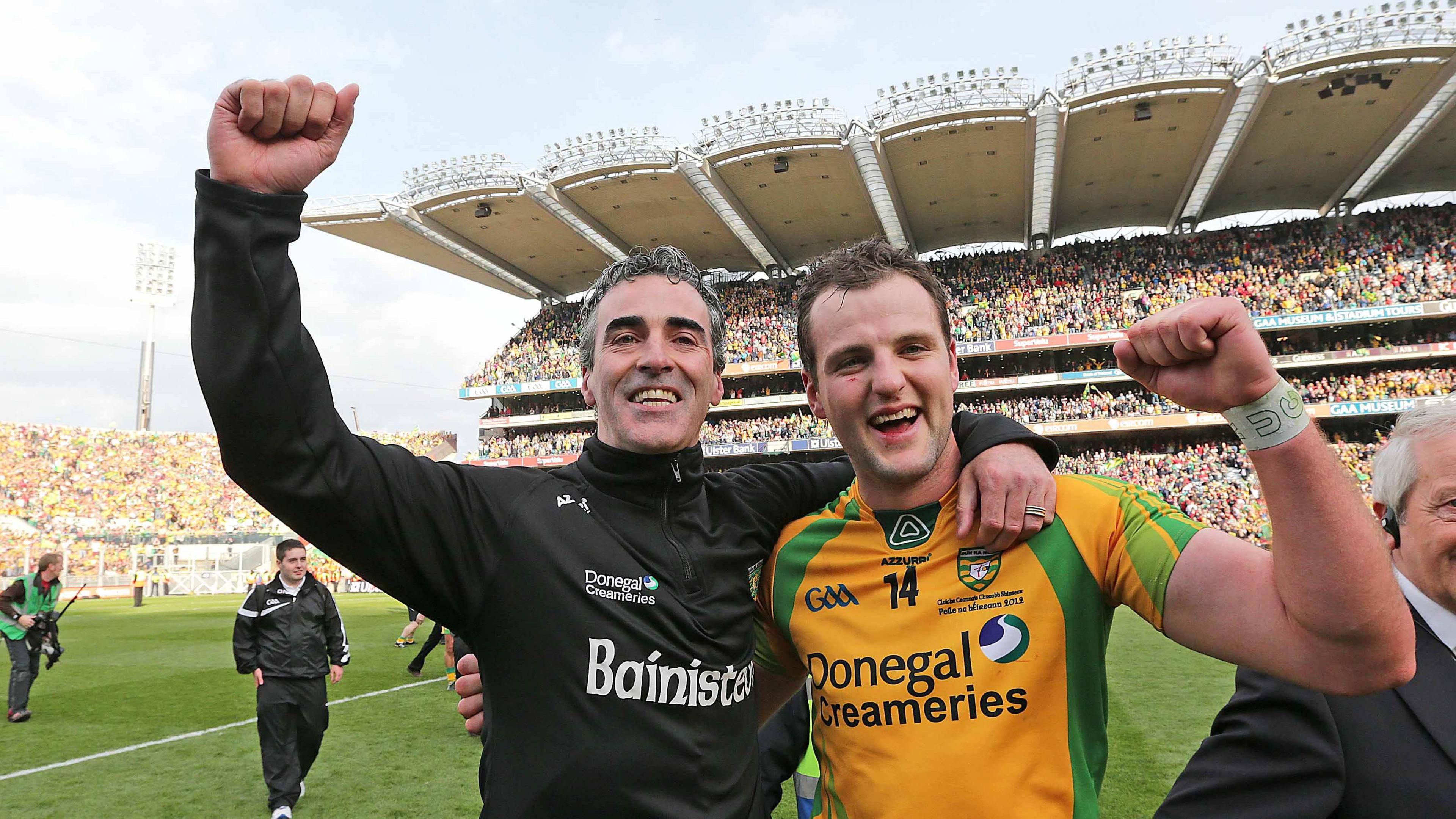 Jim McGuinness and Michael Murphy  celebrate on the pitch at Croke Park after winning the 2012 All-Ireland football final.  