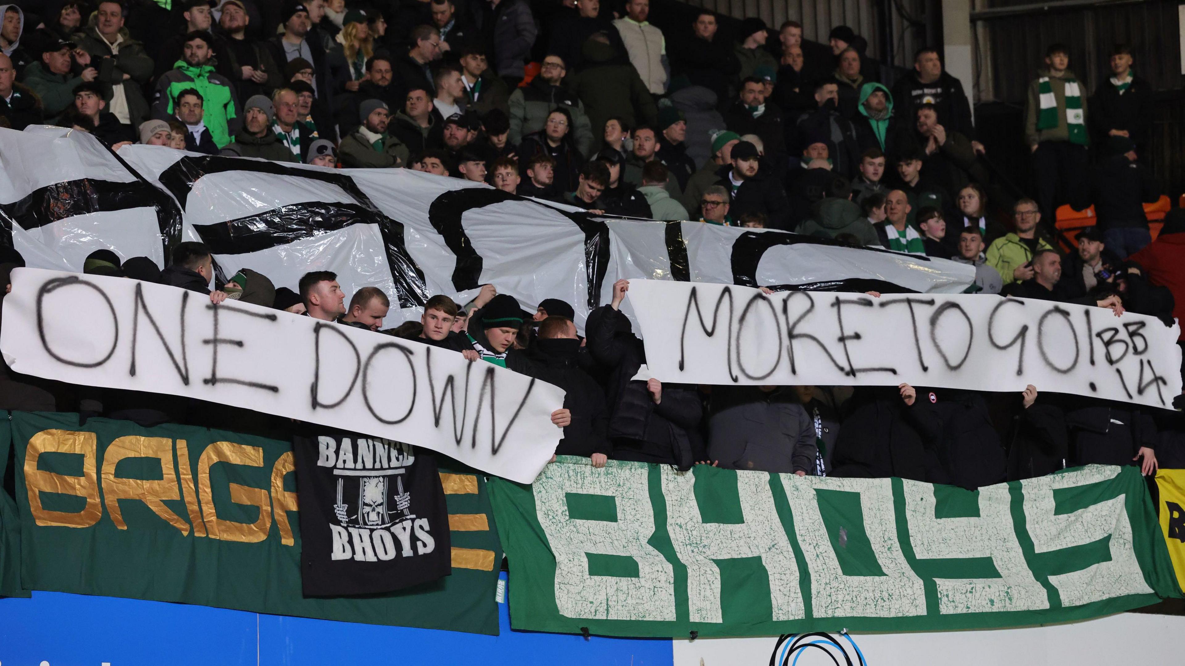 Celtic fans displayed banners protesting against the board during their game at Dundee United on Wednesday
