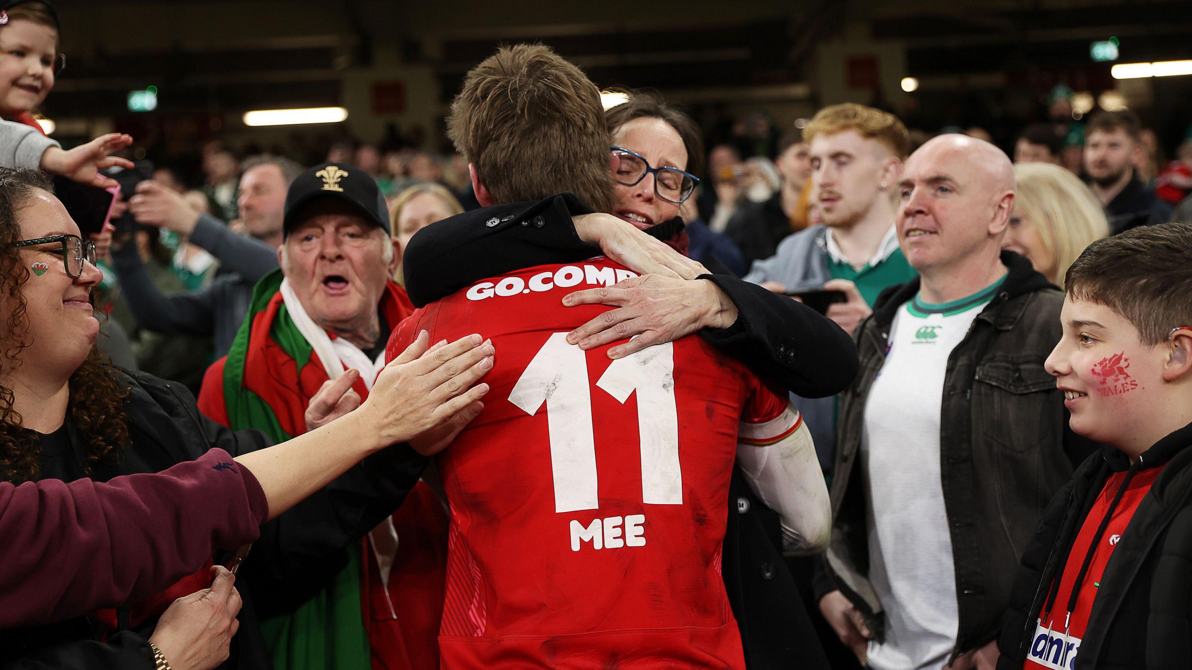 Ellis Mee with his family after winning his first cap against Ireland