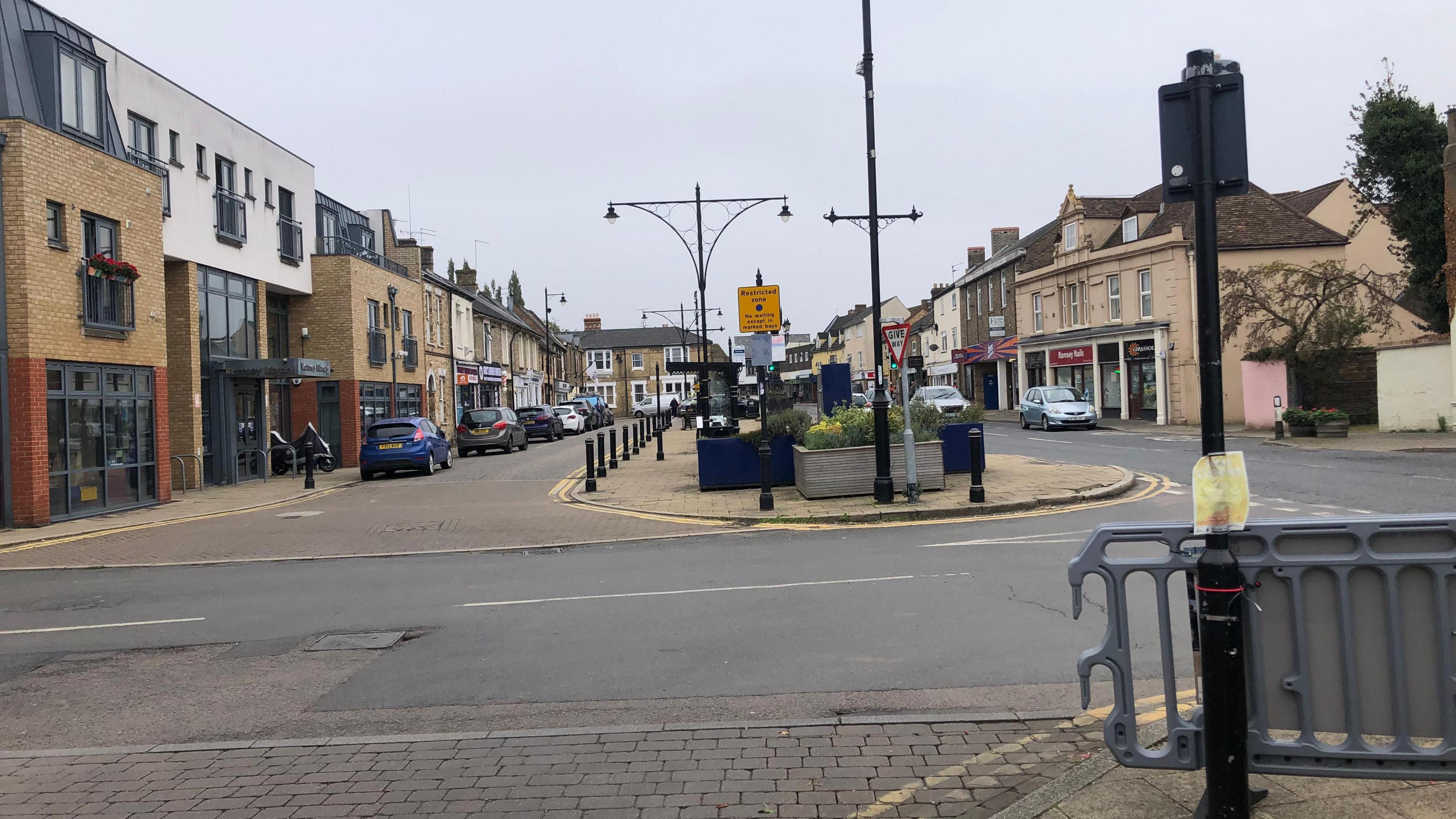 The Great Whyte is the main hub of Ramsey, it has two-way traffic on the right, which will remain, but to the left, outside the library there is a a single lane with car spaces which is the area that could be pedestrianised losing parking bays.